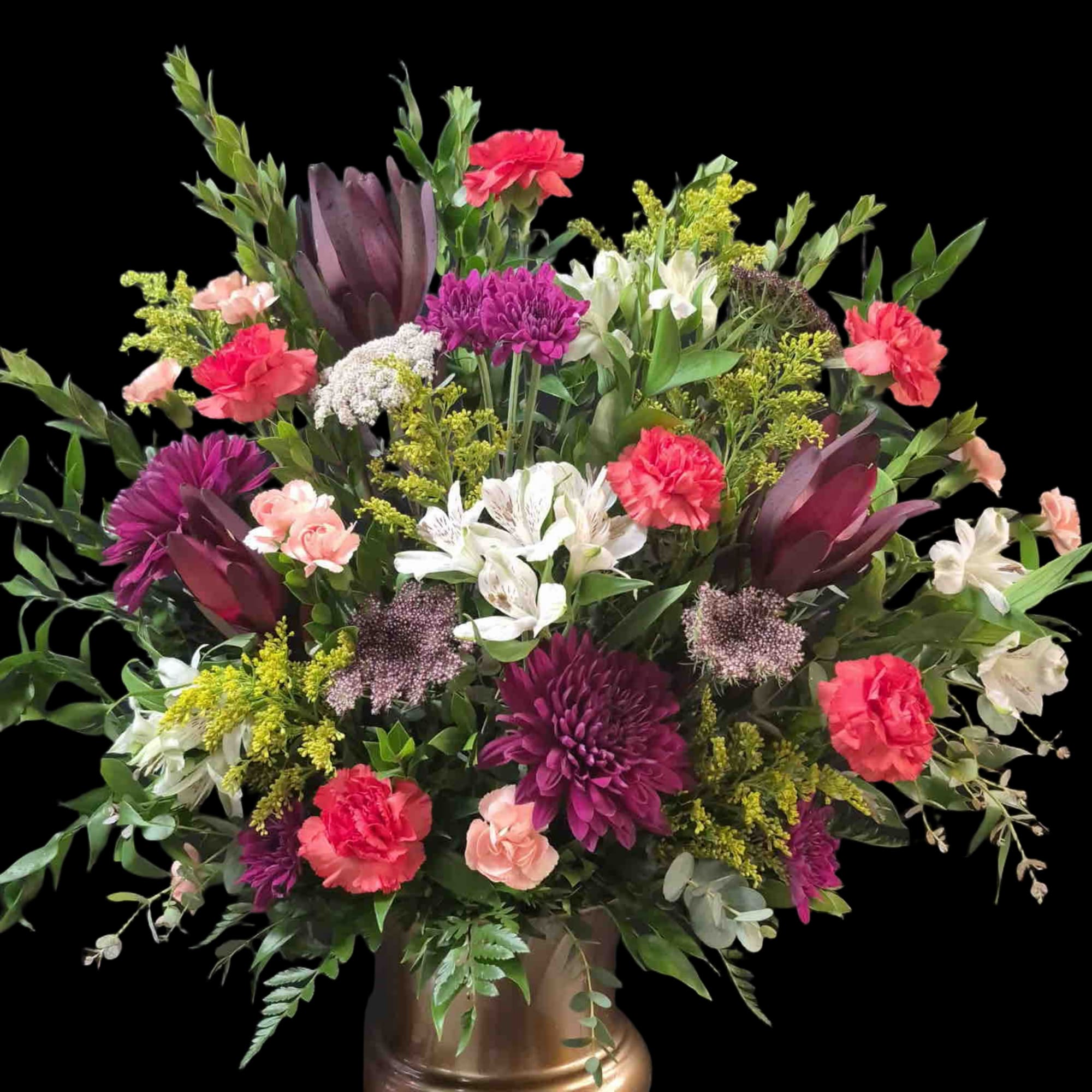 Mix of purple, orange and white flowers in a gold urn, photo 2 of 2