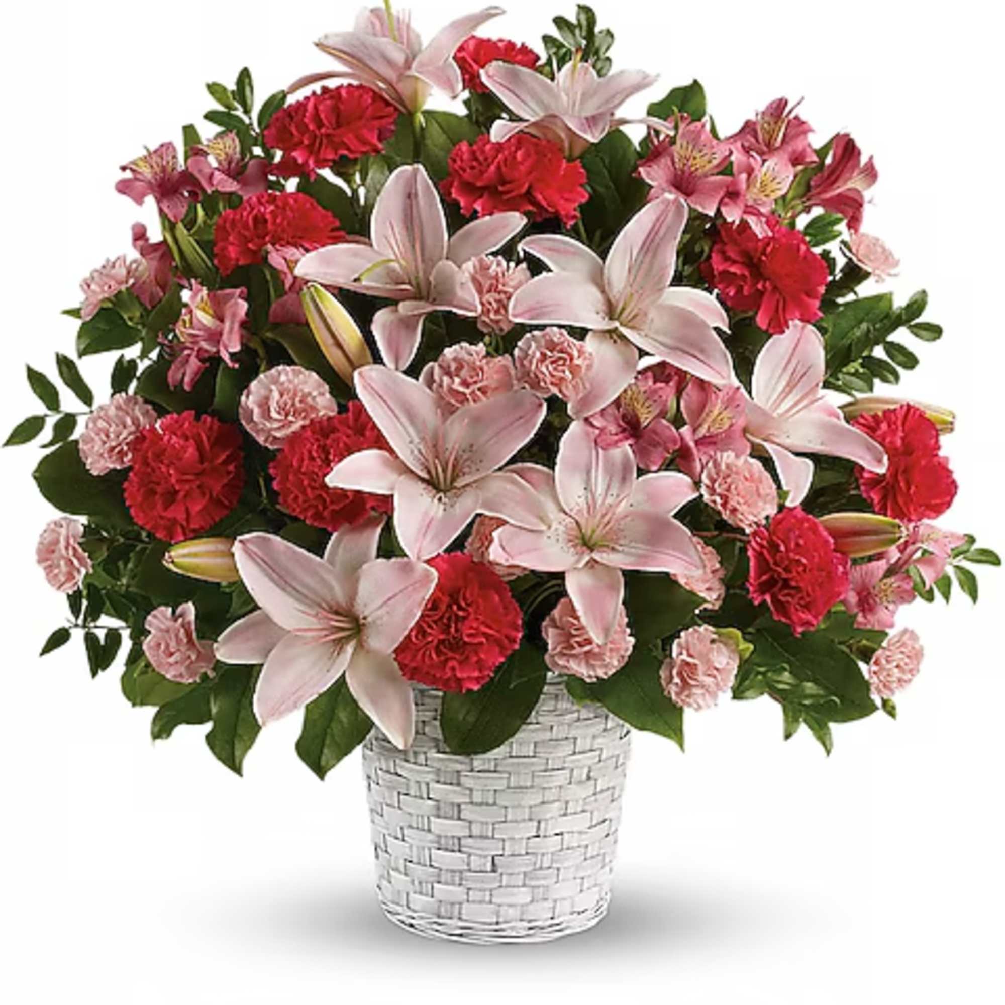 Pink lilies and red carnations in a white woven vase