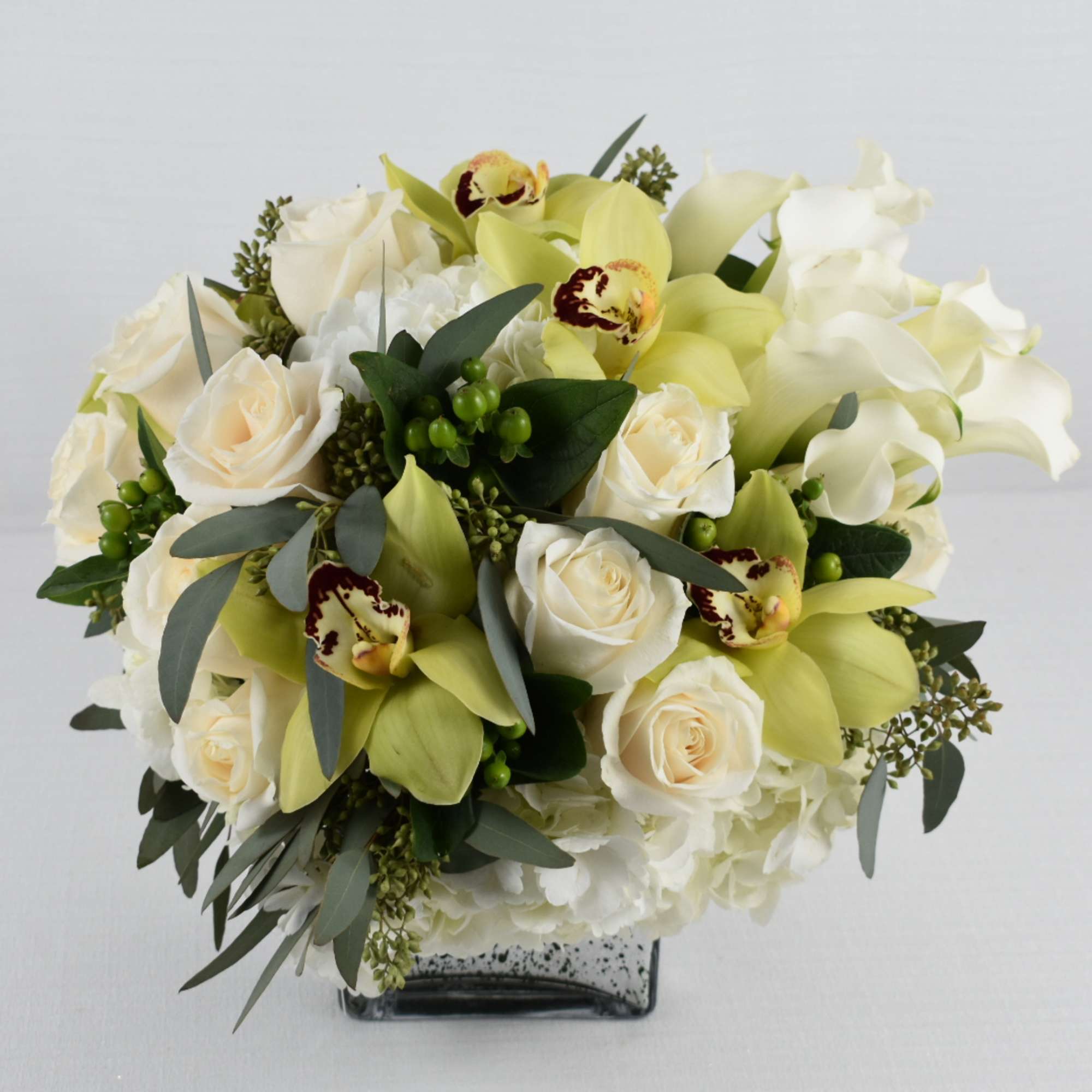 silver square vase 
with some fresh cut white roses combined with white, photo 2 of 3