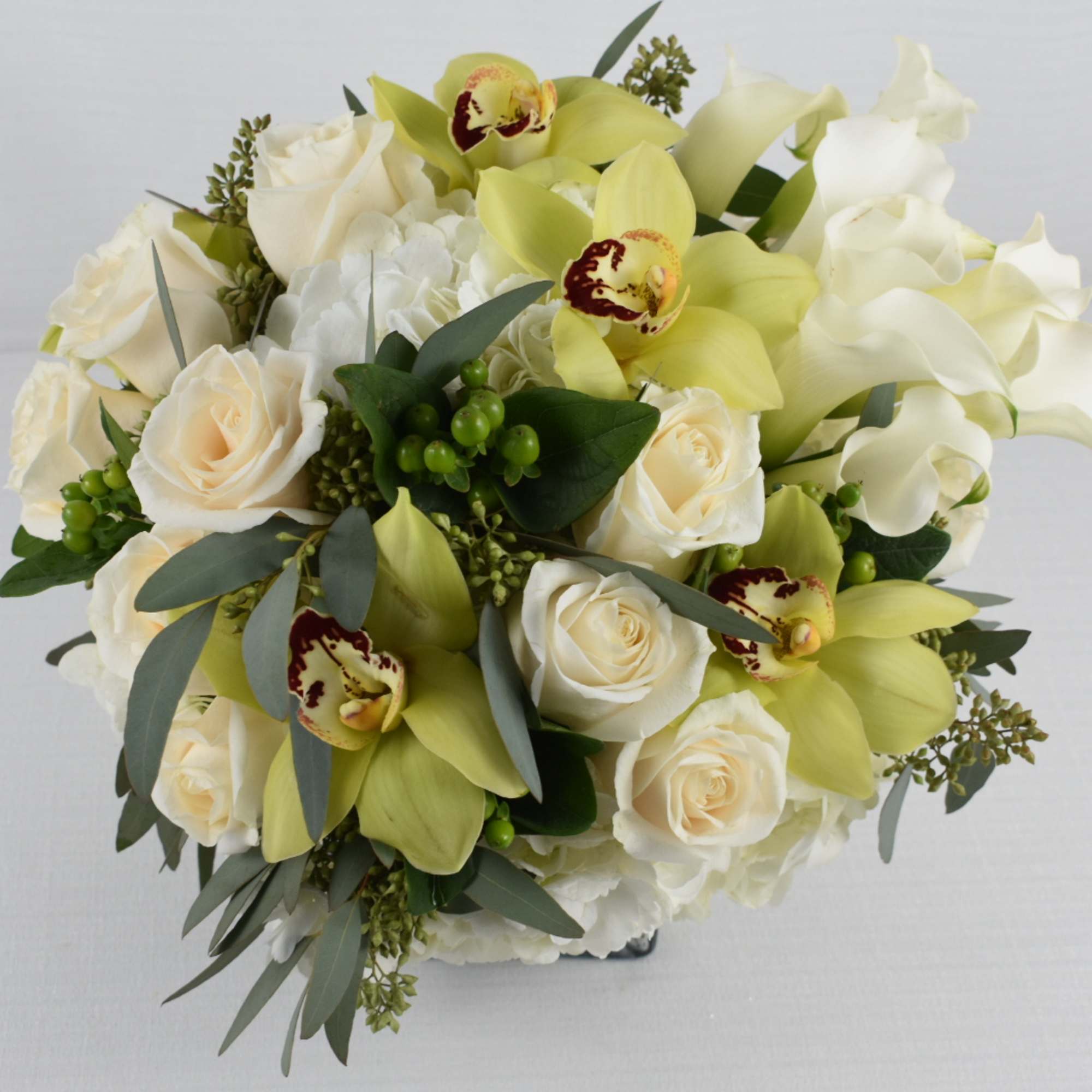 silver square vase 
with some fresh cut white roses combined with white, photo 3 of 3