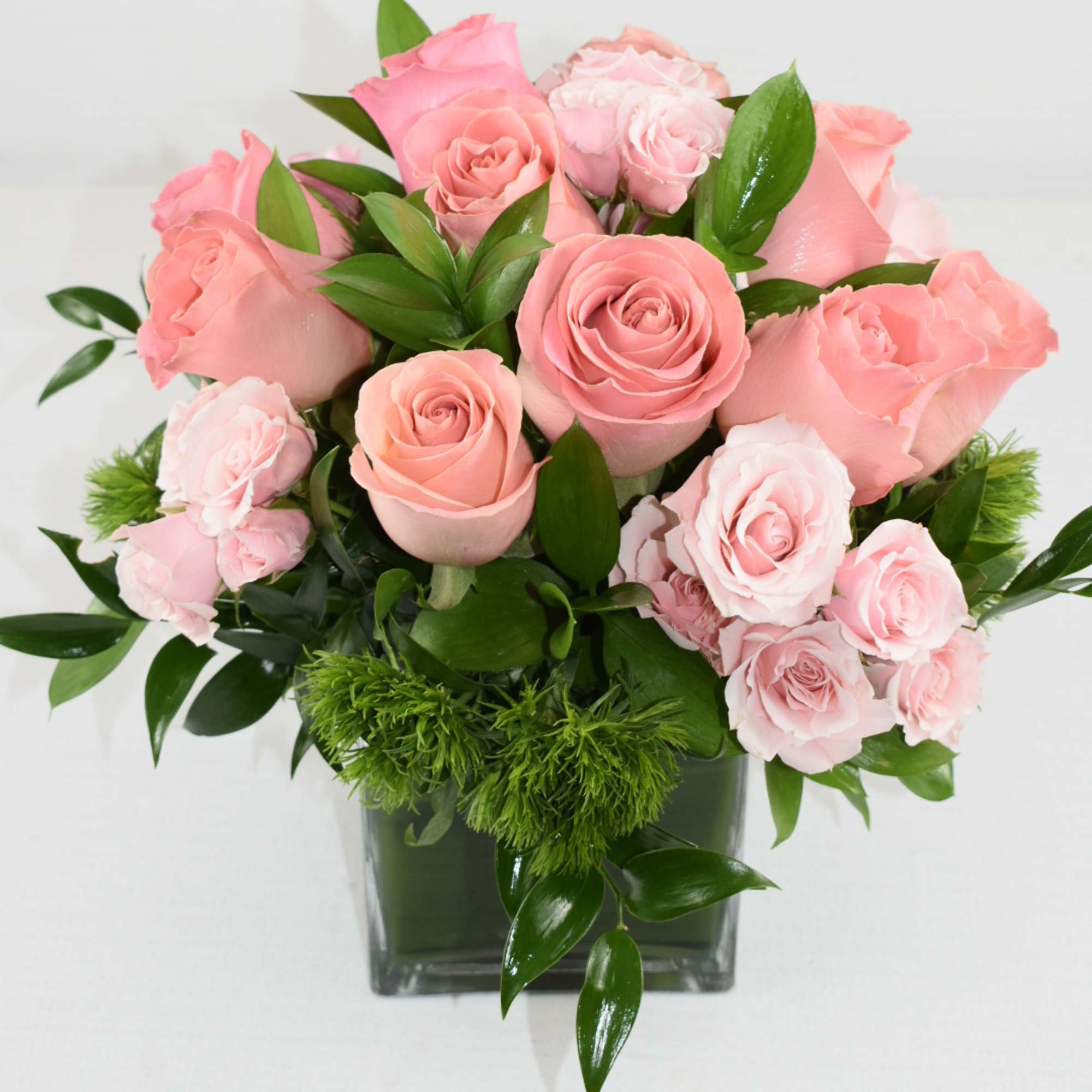 This arrangement will make them happy 
Comes in a 5X7 vase with