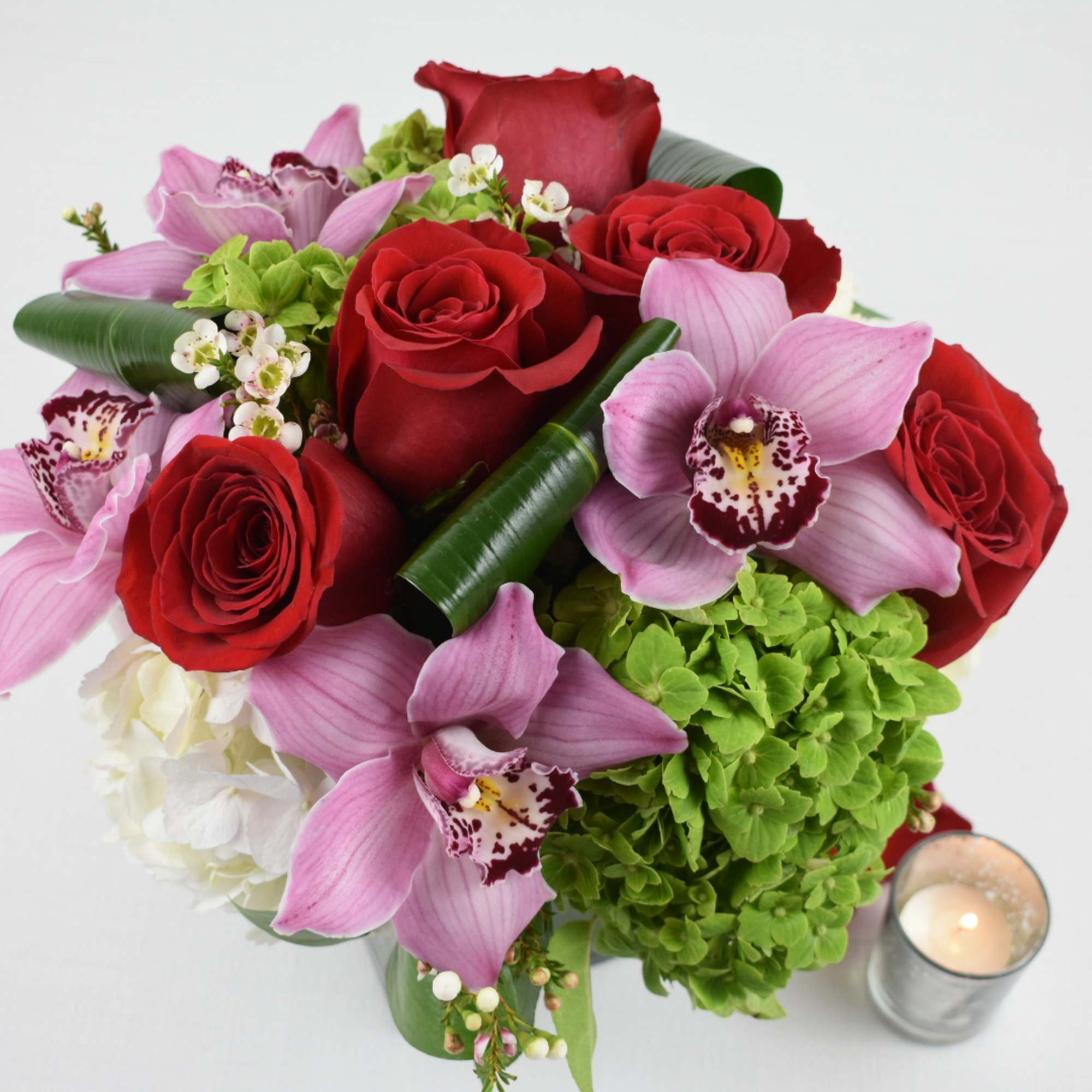 Just Beautiful 
This floral arrangement comes in a square vase 5X5 
contains, photo 2 of 2