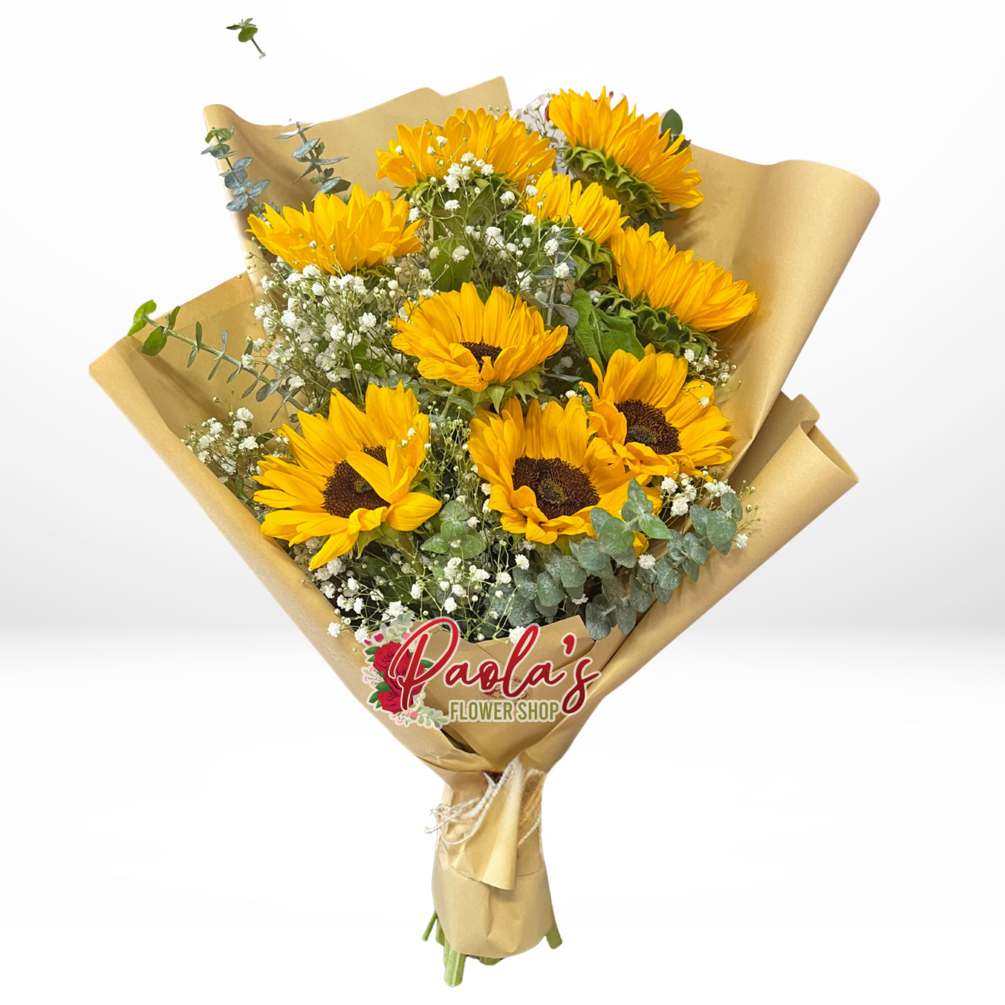 Bouquet of yellow sunflowers wrapped in gold paper