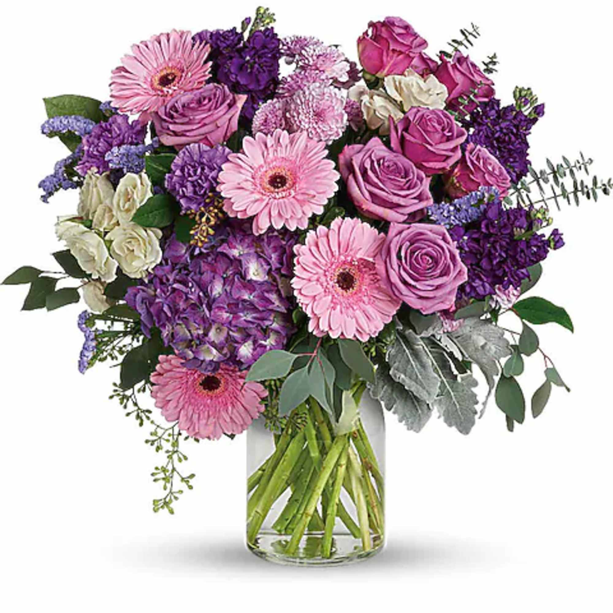 Pink and purple mixed bouquet in a clear glass vase