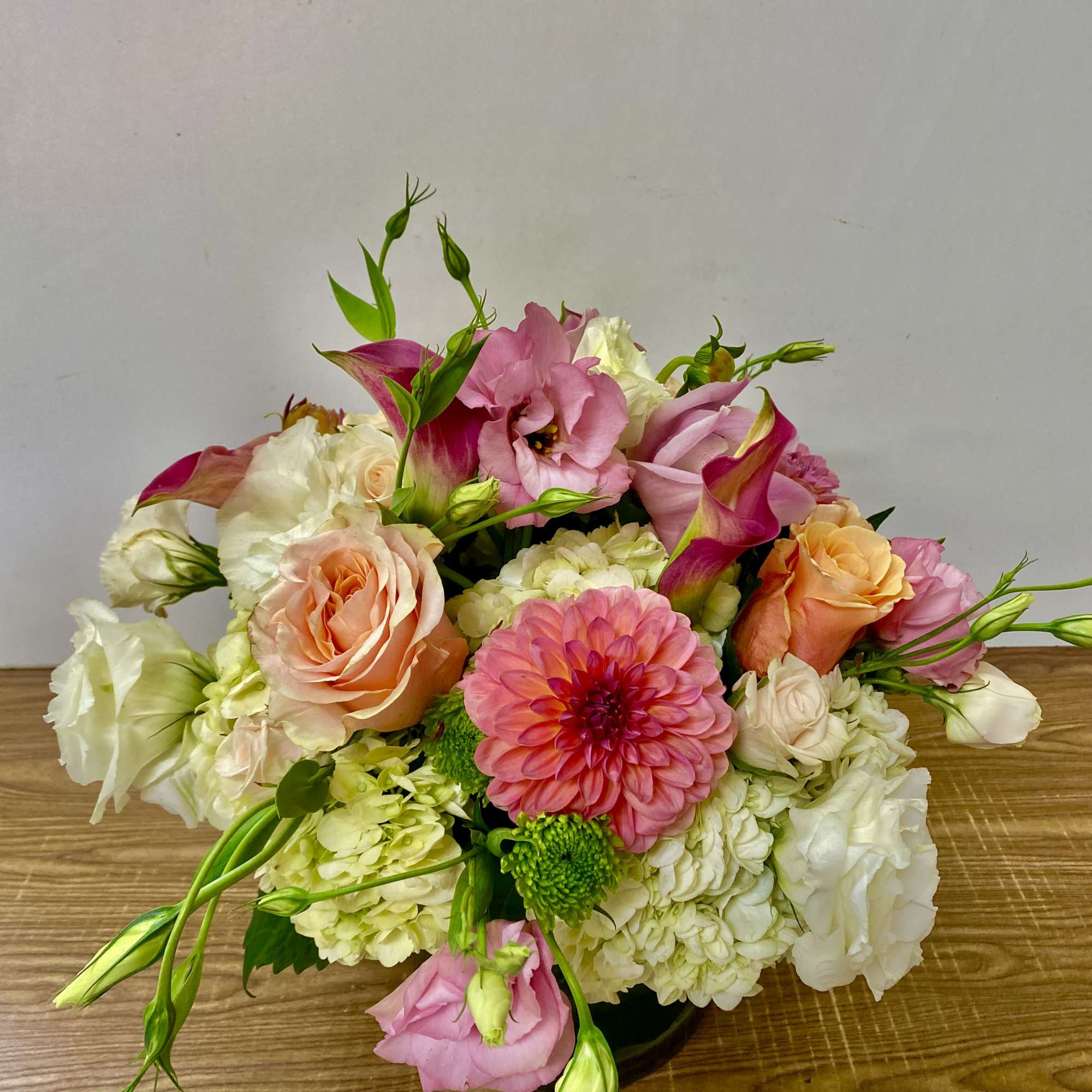 Pink and white mixed bouquet with roses, calla lilies, and dahlias