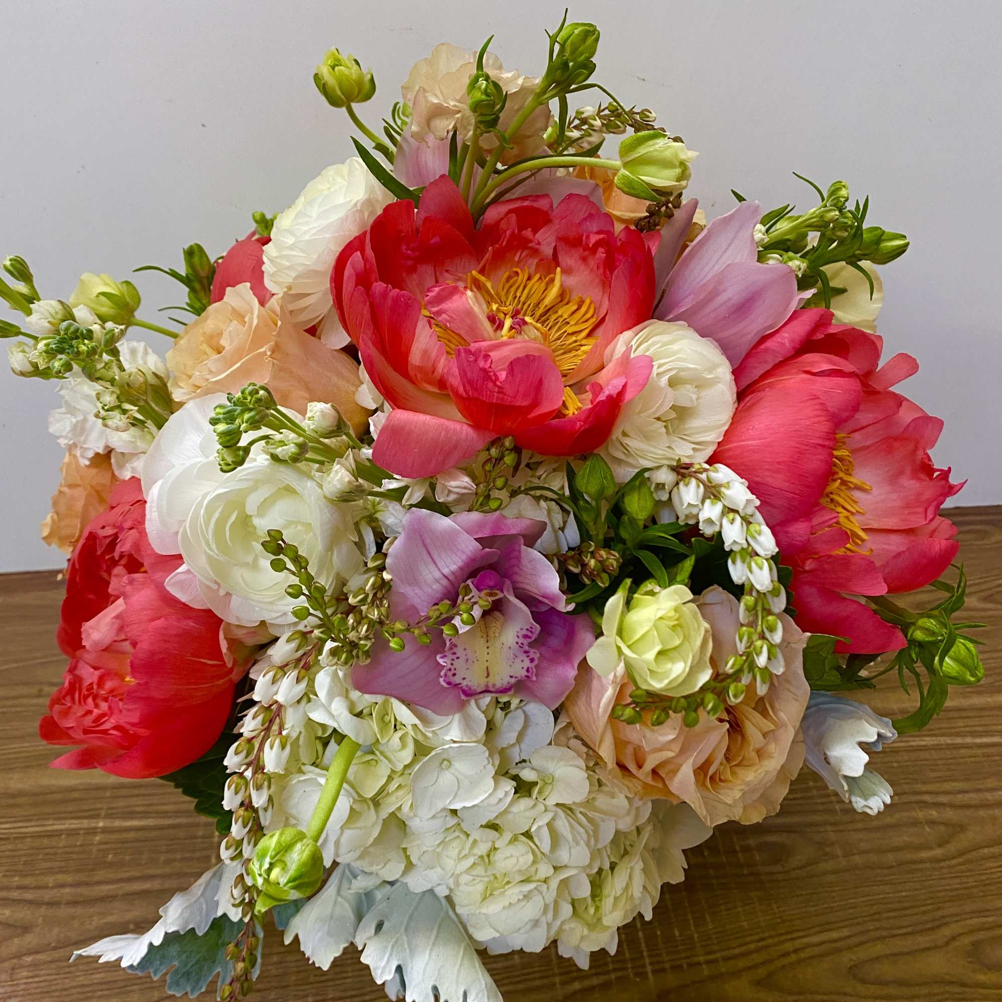 Bright mixed bouquet with pink, white, and peach blooms