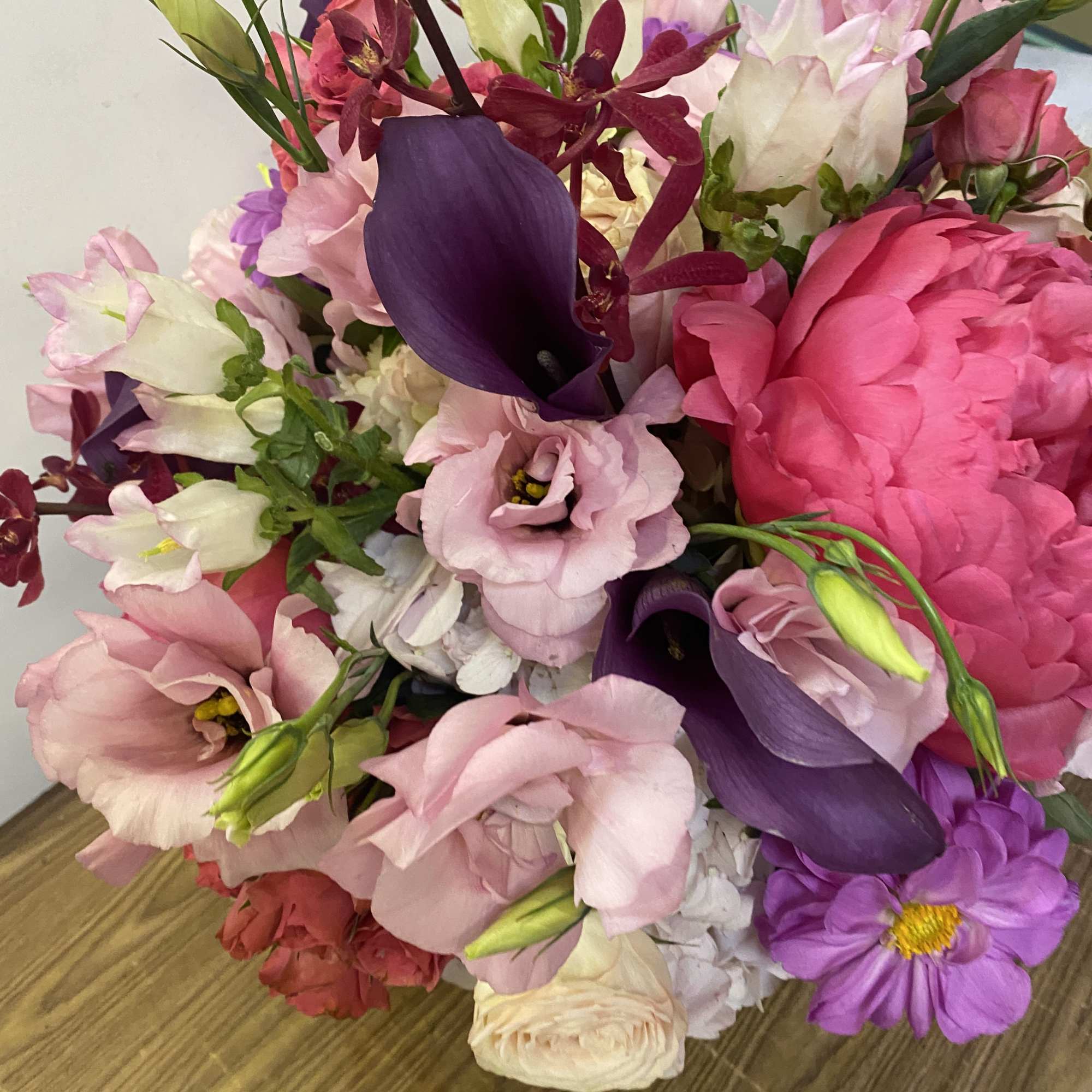 Mixed bouquet of pink, purple, and white flowers