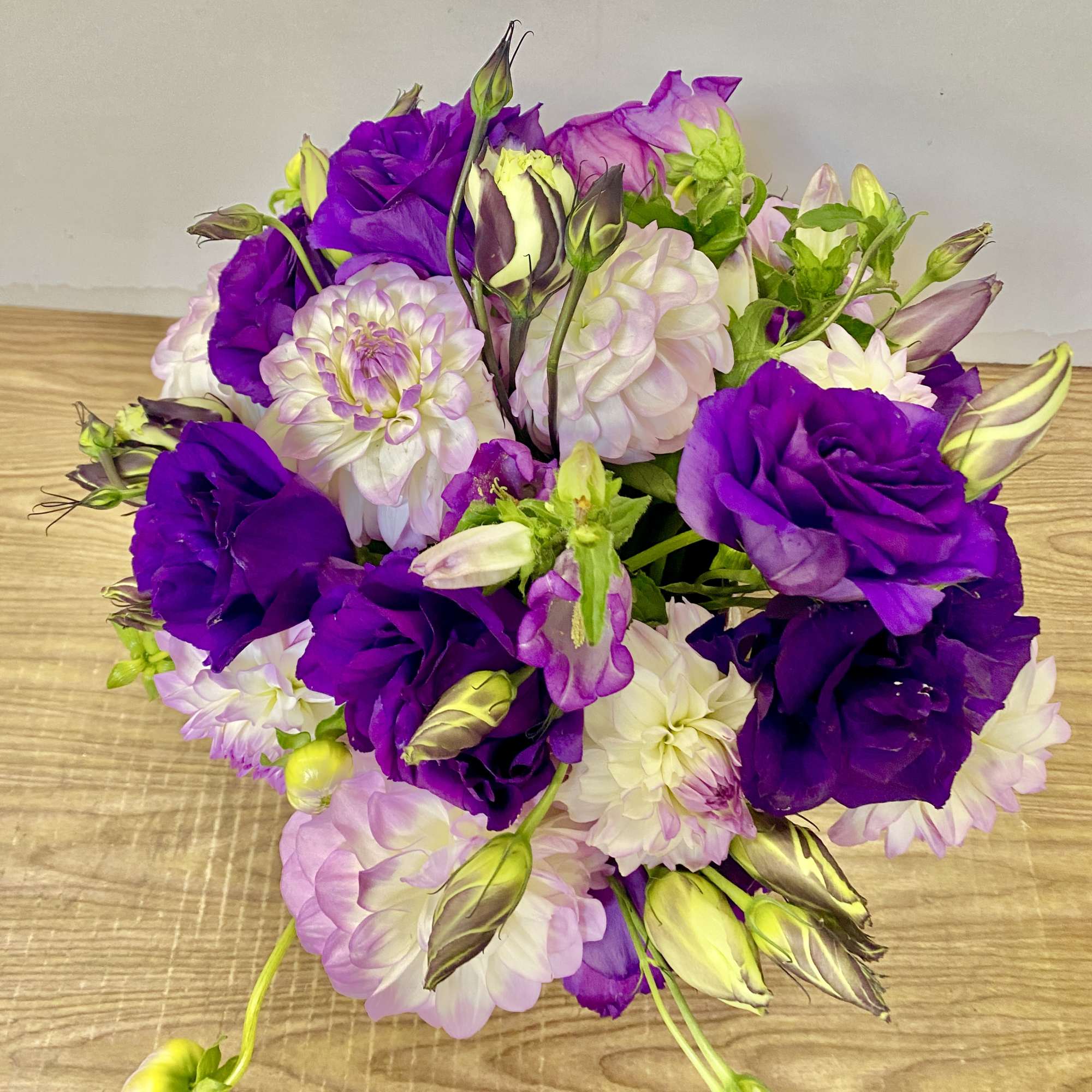 Bouquet of purple and pale pink flowers with unopened buds