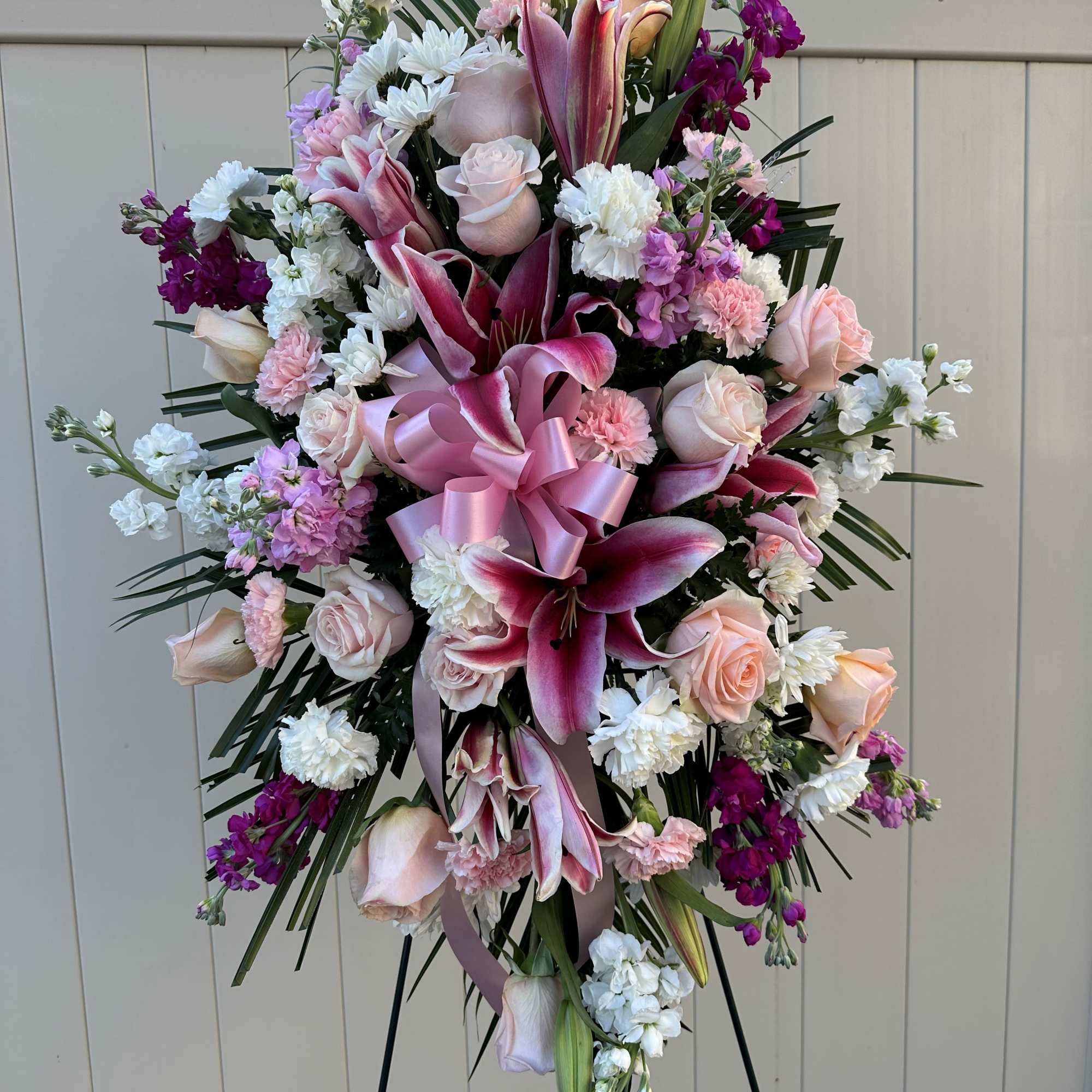 The soft blush roses, stargazer lilies, and layers of pinks, whites, and, photo 2 of 2