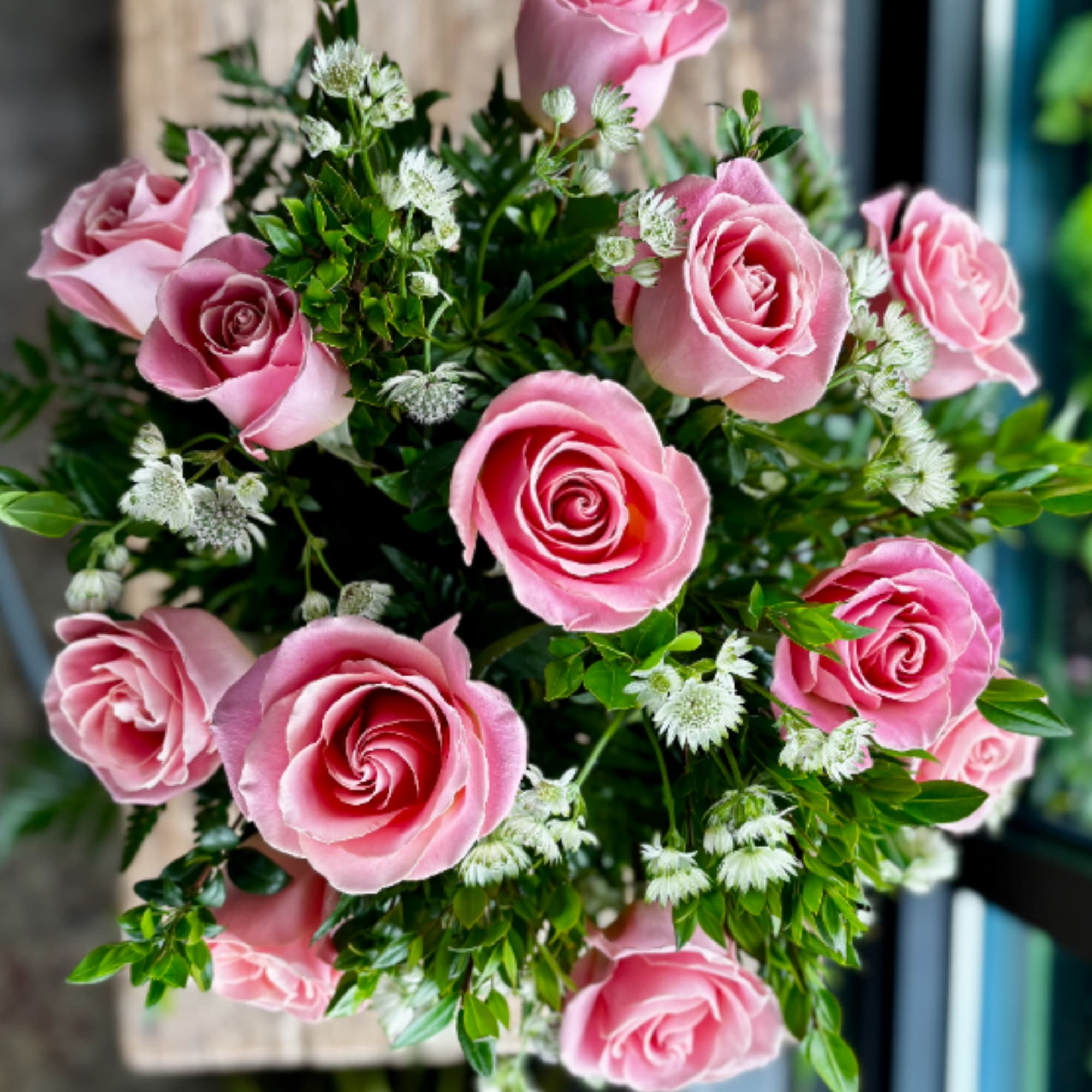 12 pink roses designed in a traditional style.
, photo 2 of 2