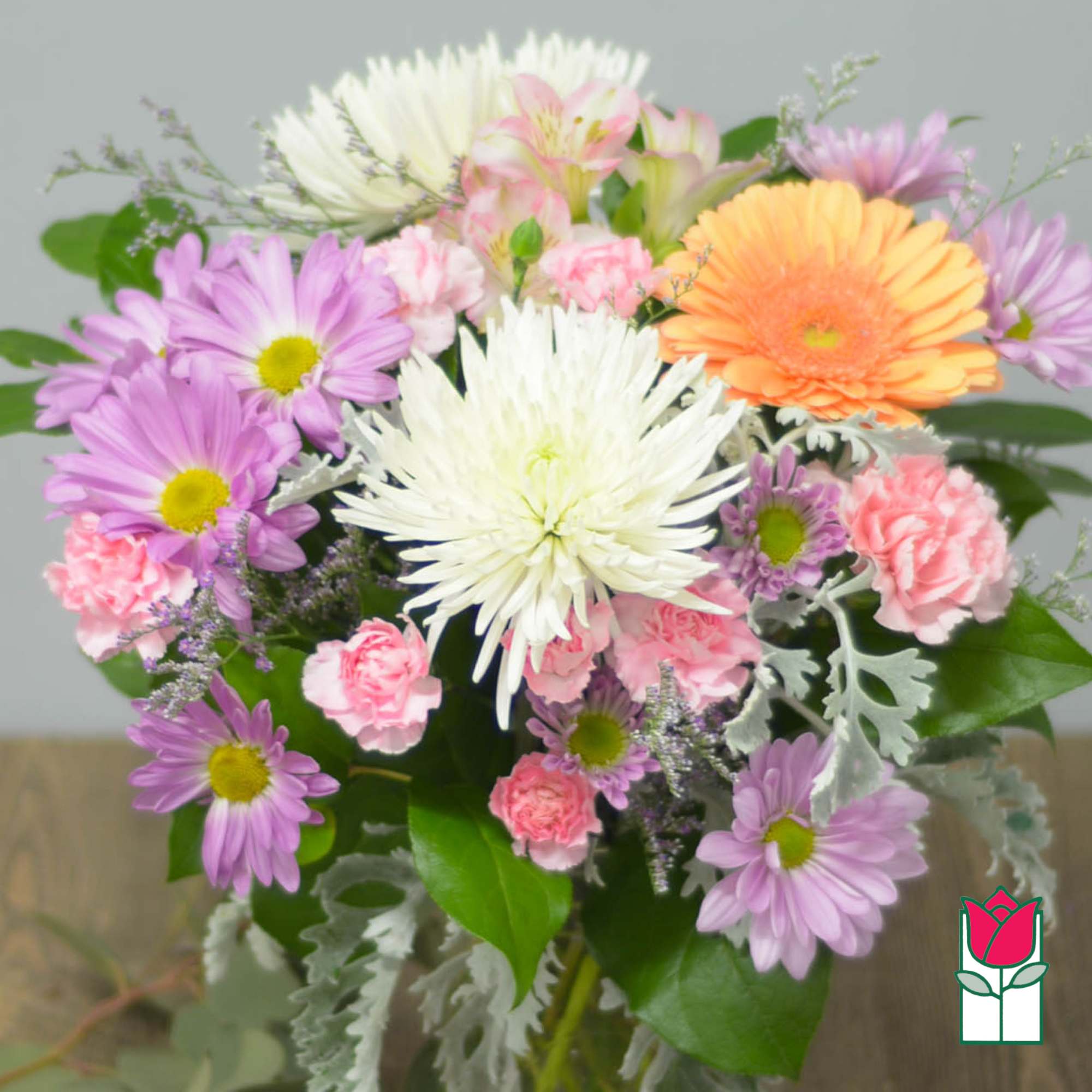 Bouquet of purple, pink, white, and orange daisies with carnations