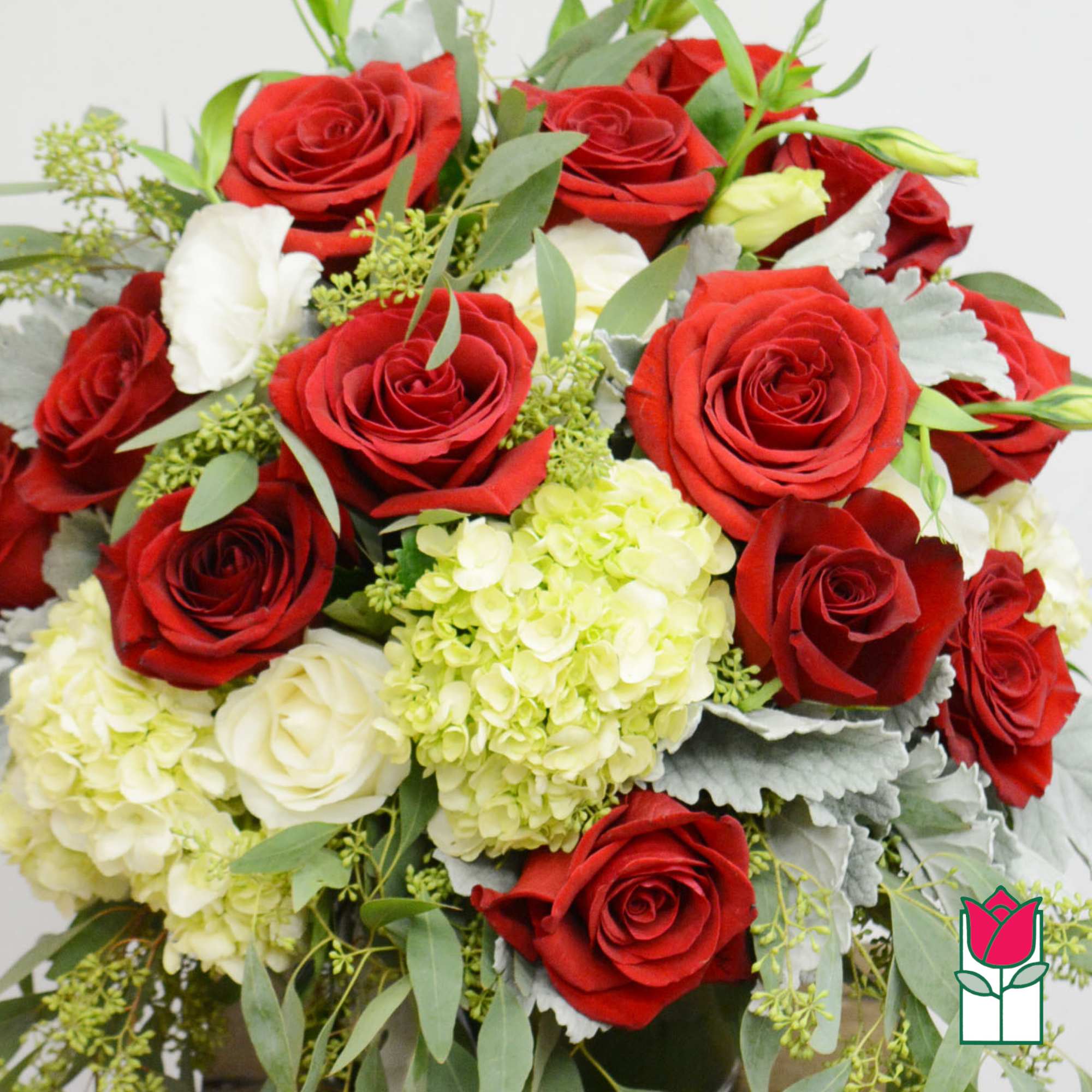 Bouquet of red and white roses with pale green hydrangeas