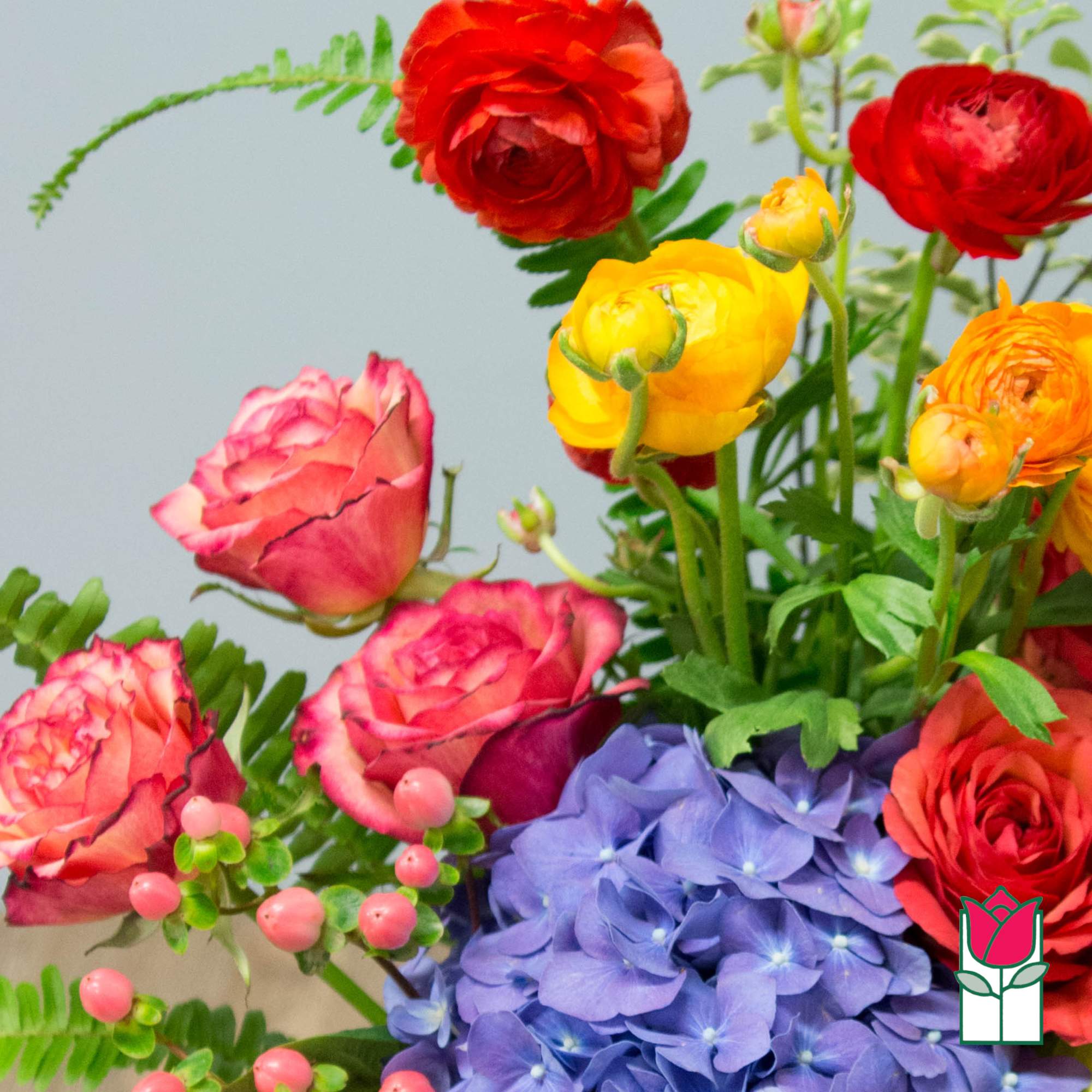 Bouquet of colorful roses and purple hydrangeas