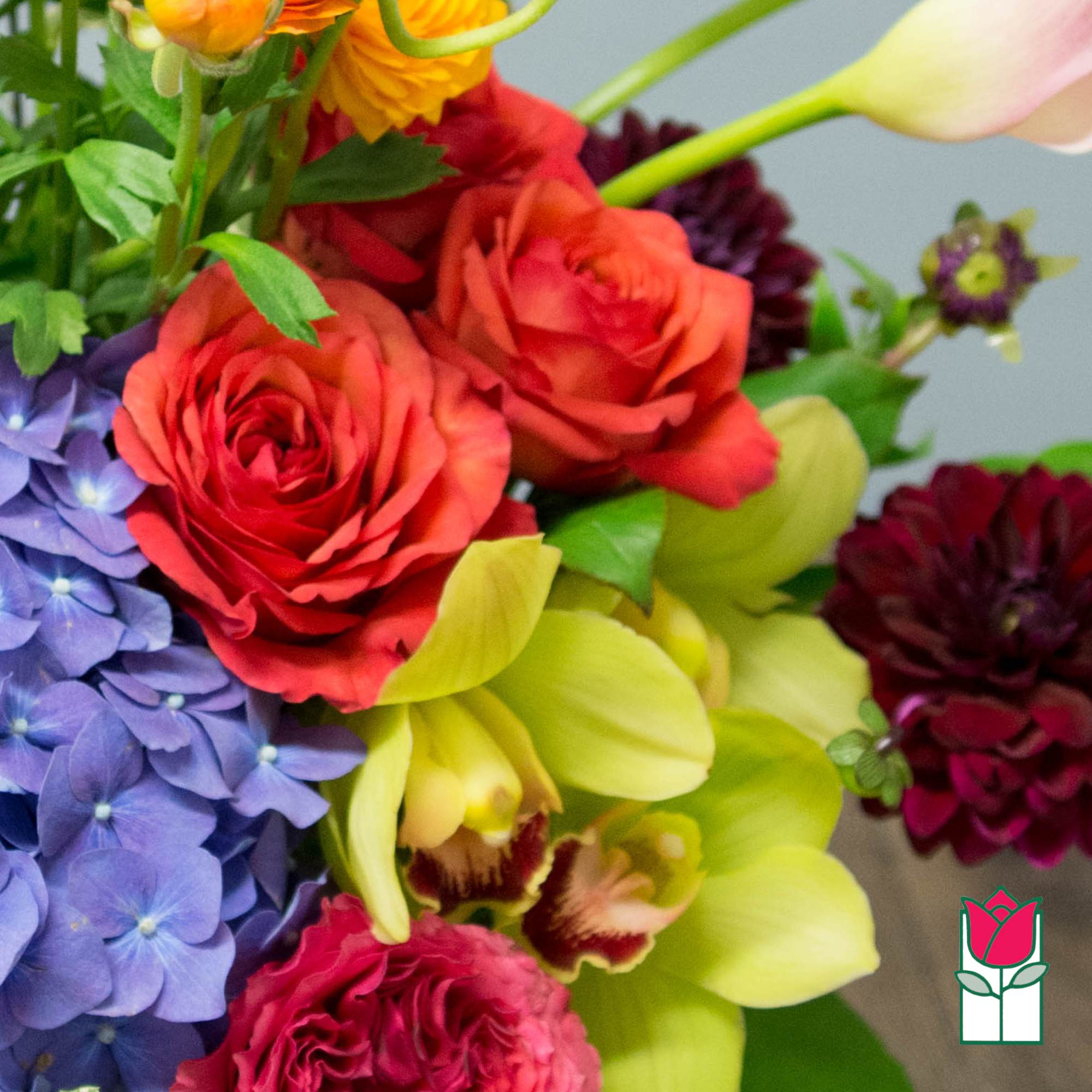 Colorful bouquet with roses, hydrangea, and orchids