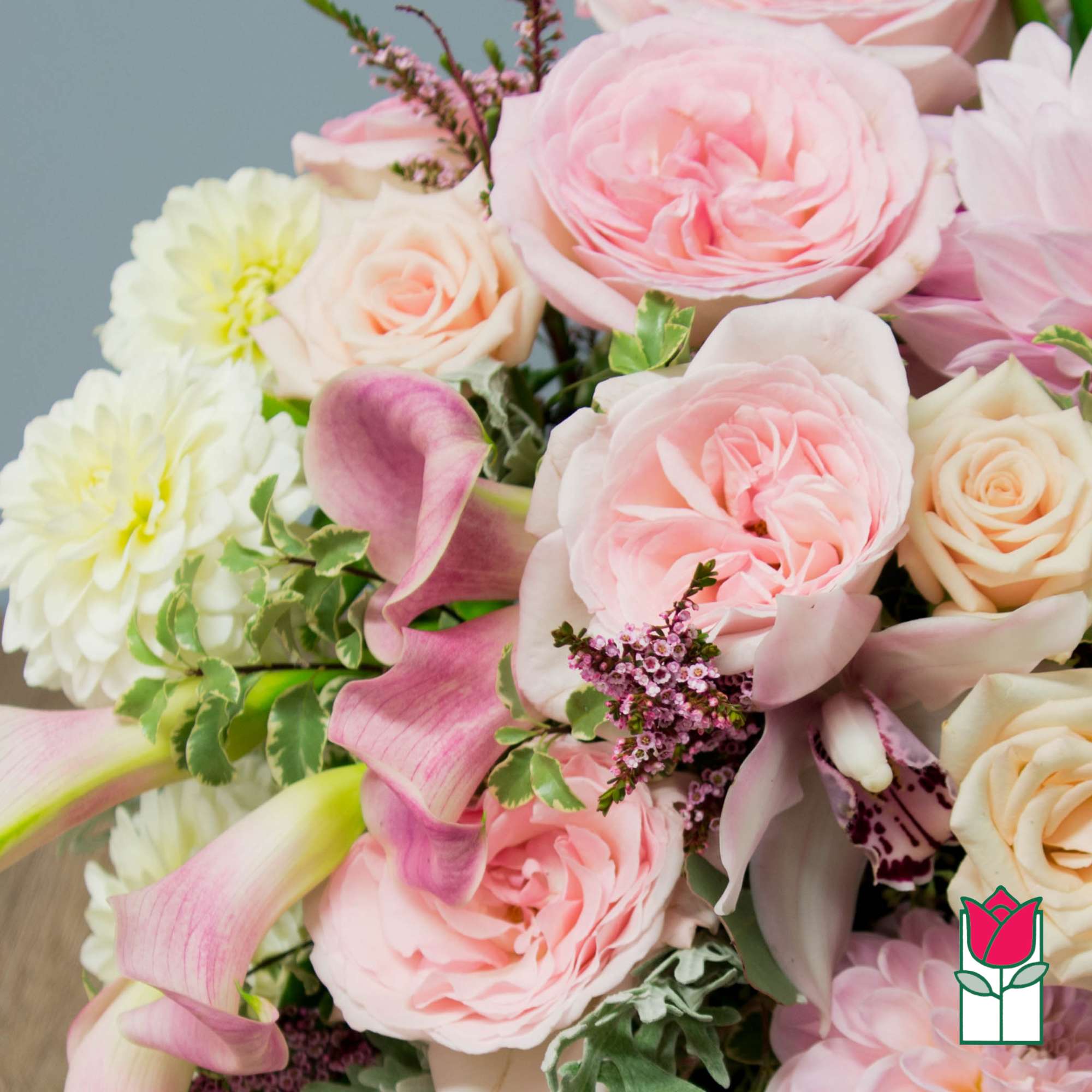Bouquet of pink roses, calla lilies, and white chrysanthemums