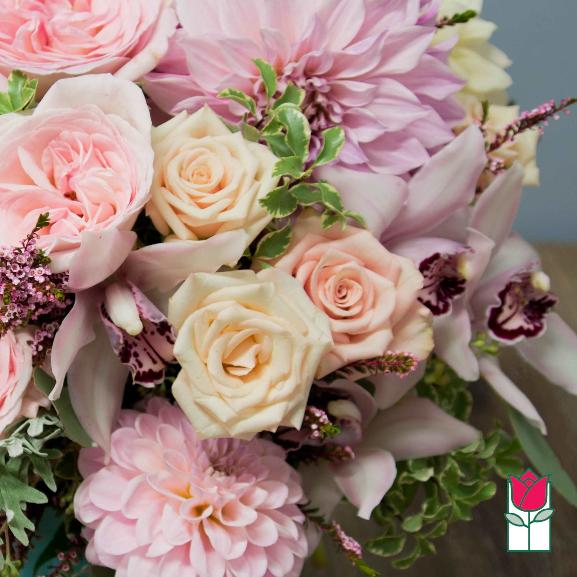 Pink and cream bouquet with roses and dahlias