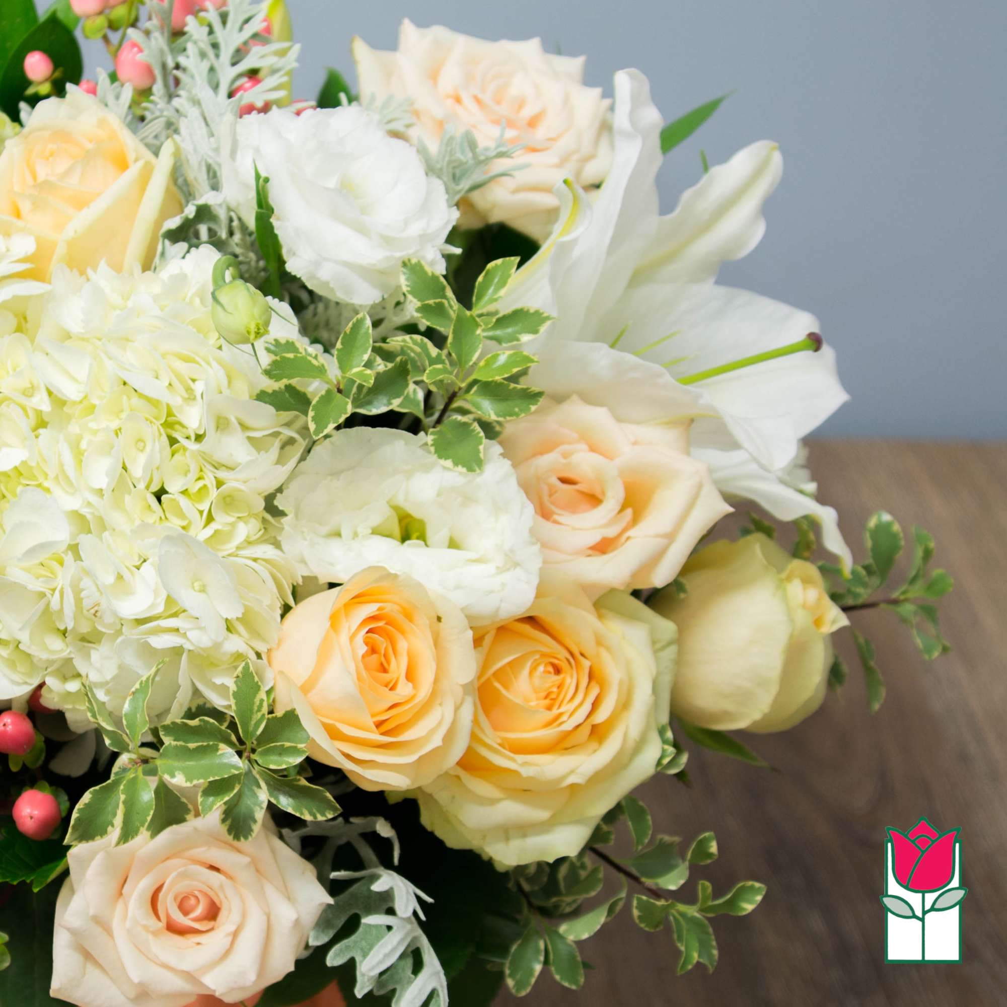 Bouquet of pale yellow and white roses with white lilies and hydrangea