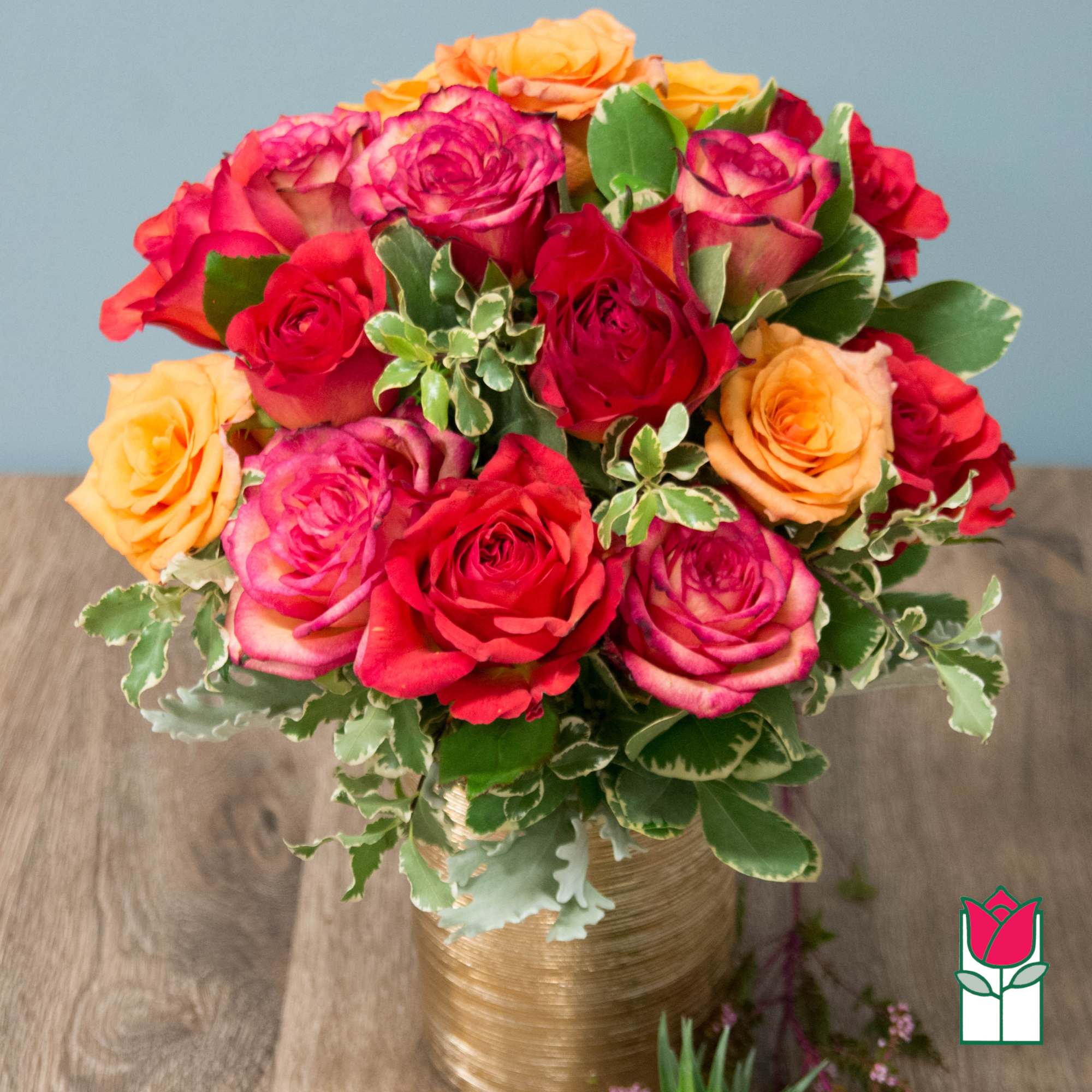 Bouquet of multicolored roses in a gold vase, photo 2 of 4