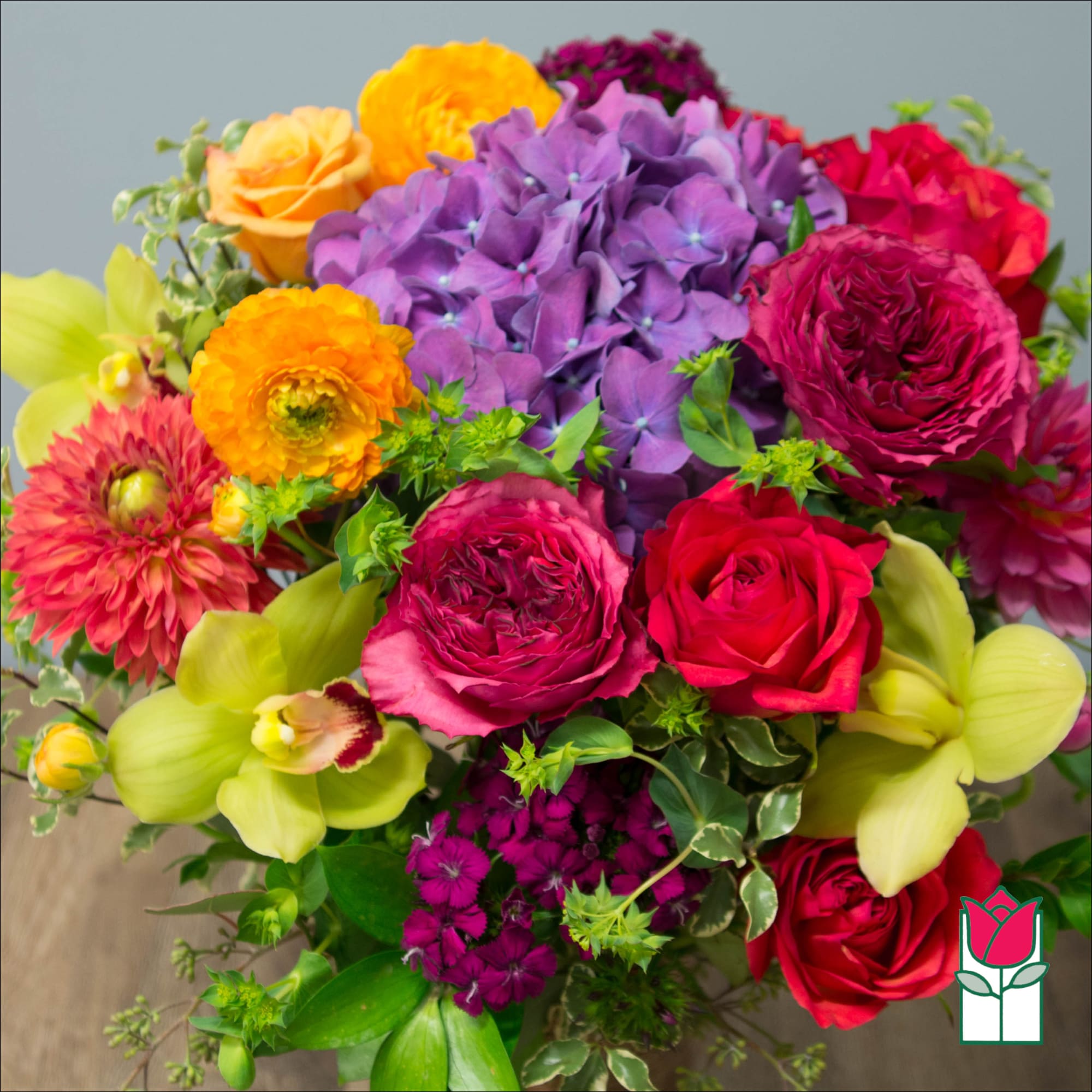 Colorful bouquet with roses, hydrangea, and orchids