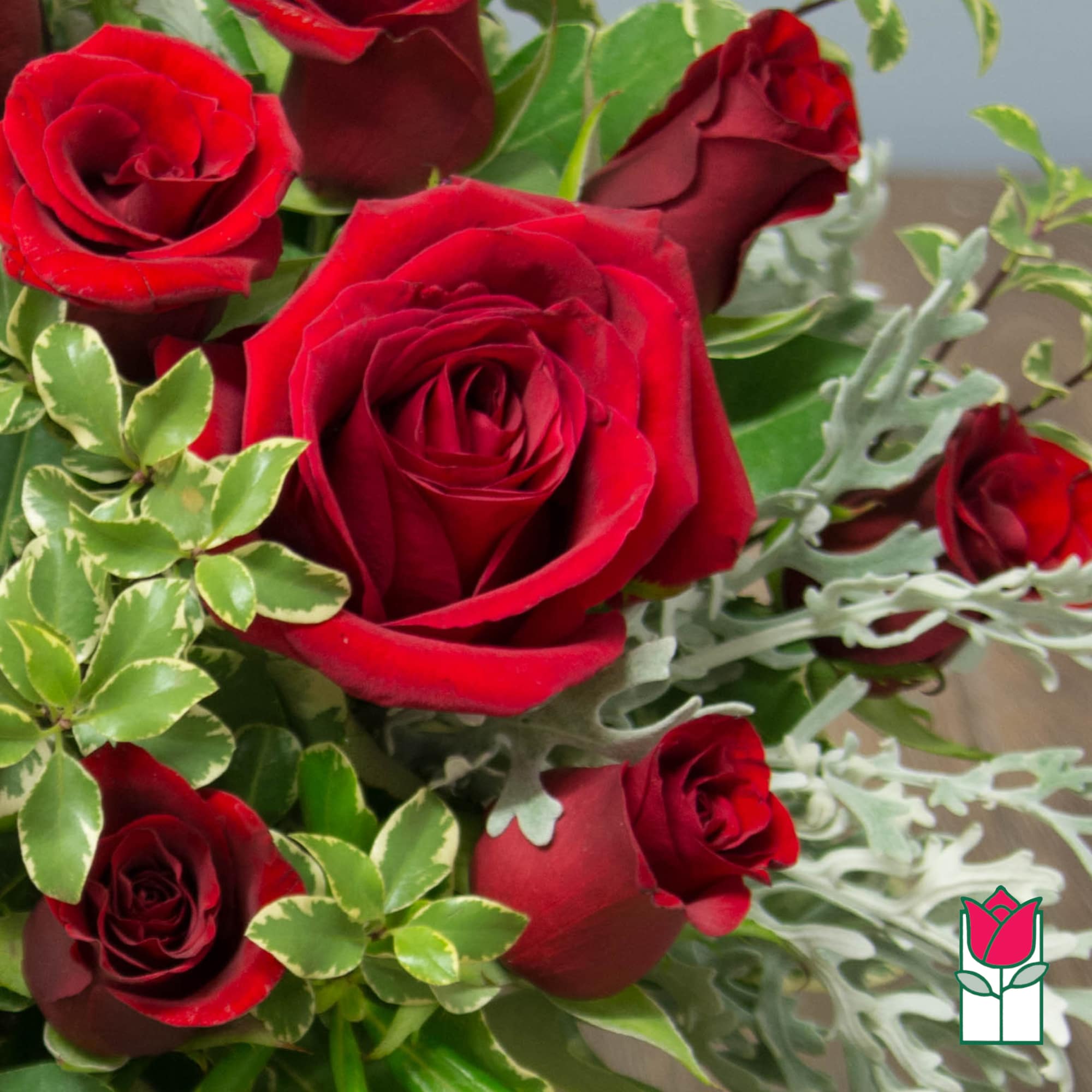 Bouquet of red roses with variegated greenery, photo 4 of 4