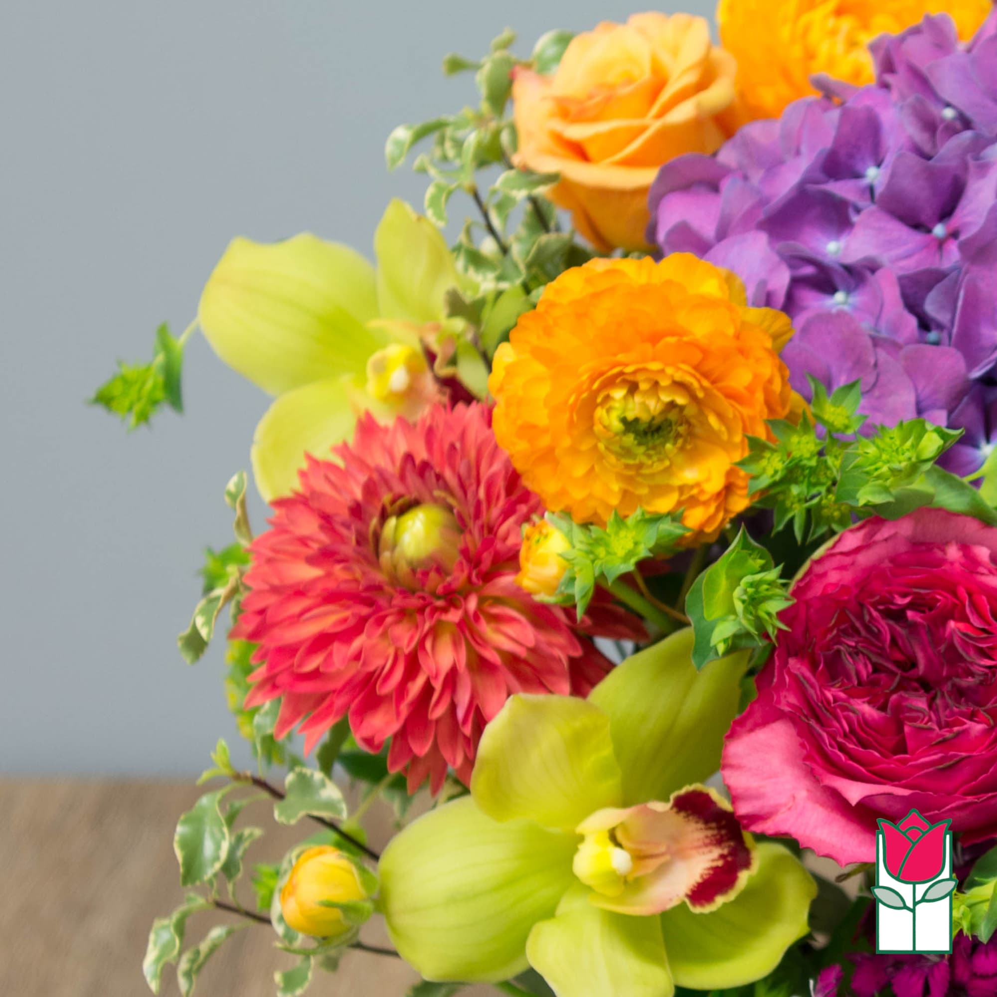 Colorful bouquet with orange, purple, pink, and green flowers