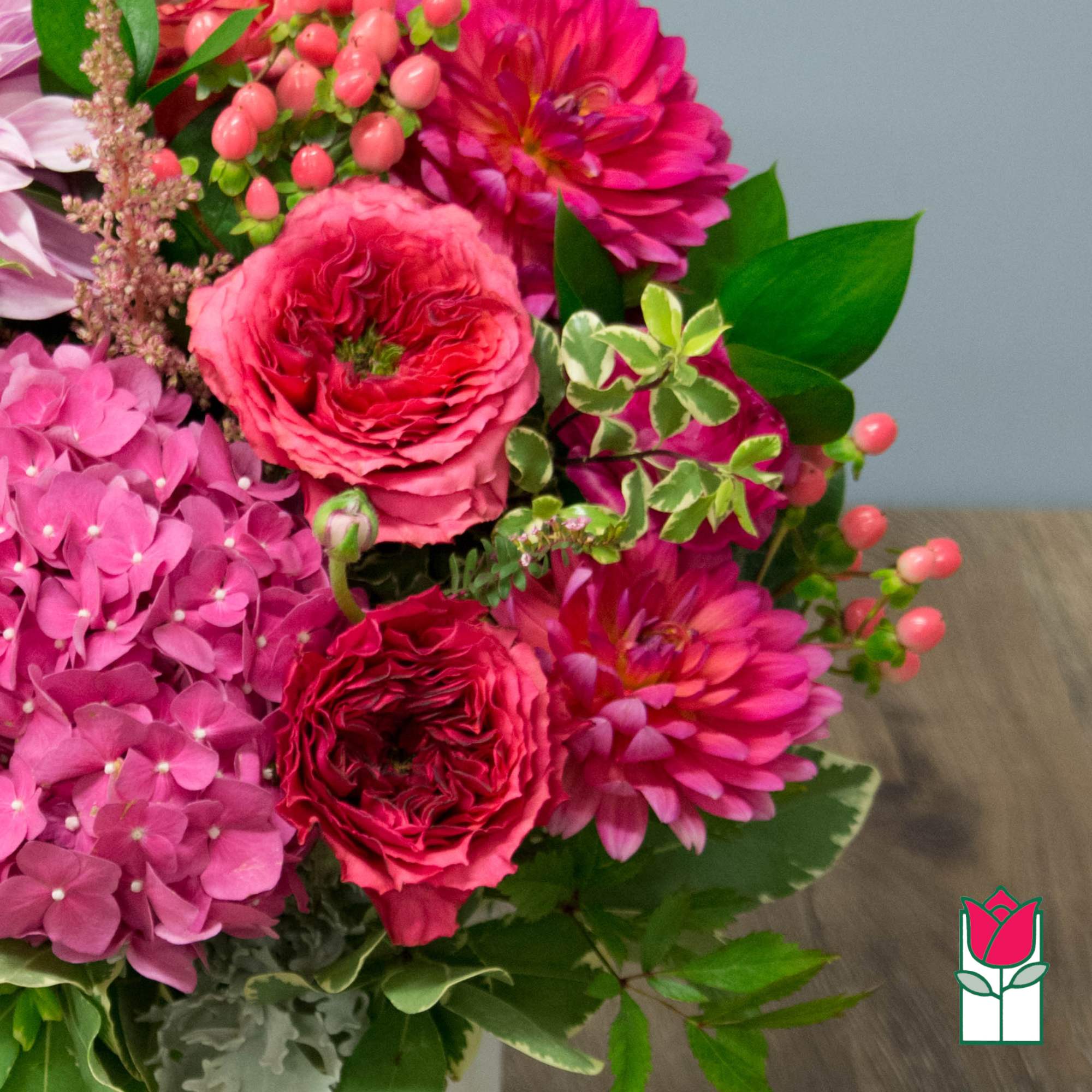 Pink and magenta bouquet with hydrangeas, roses, and dahlias