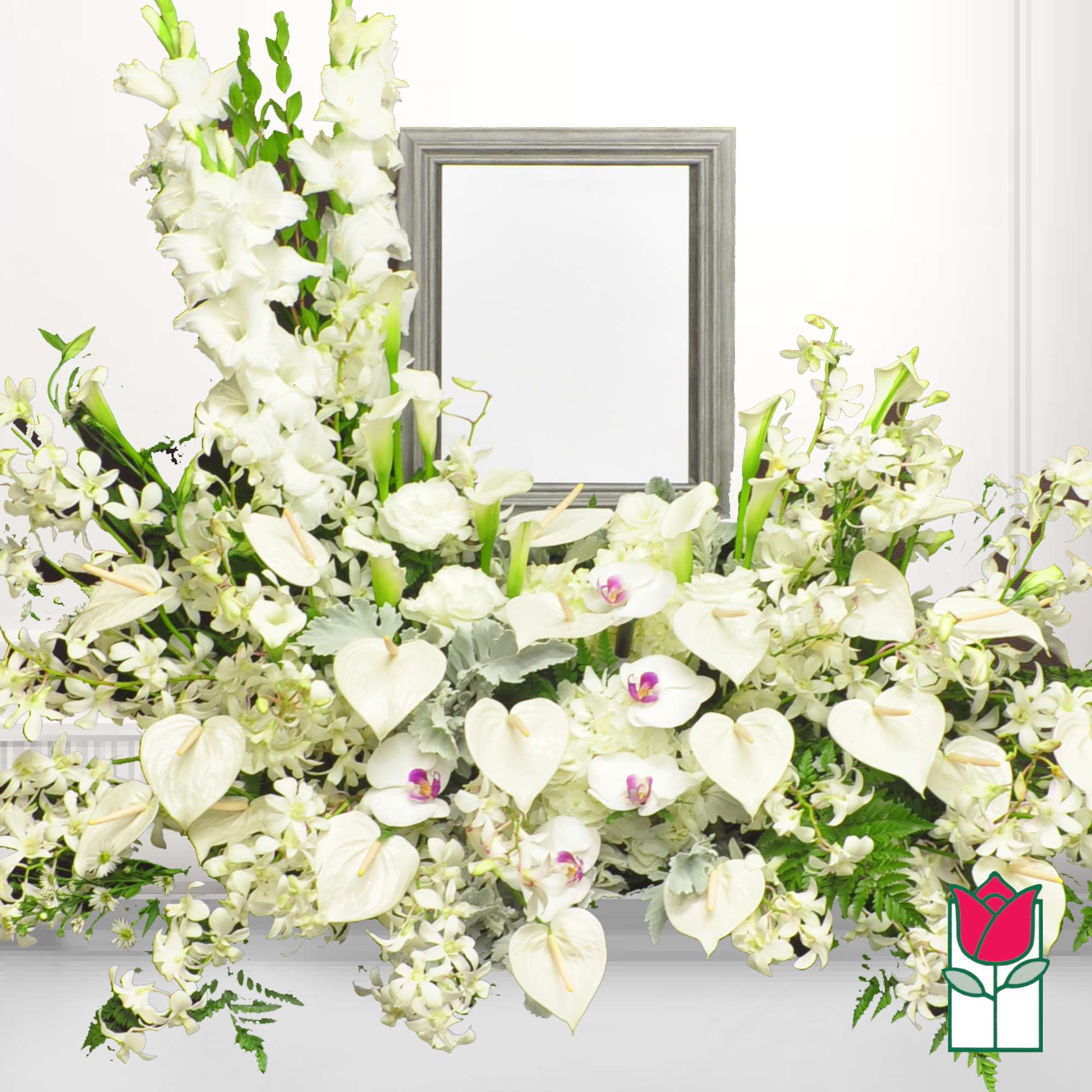 White floral funeral spray with orchids and calla lilies