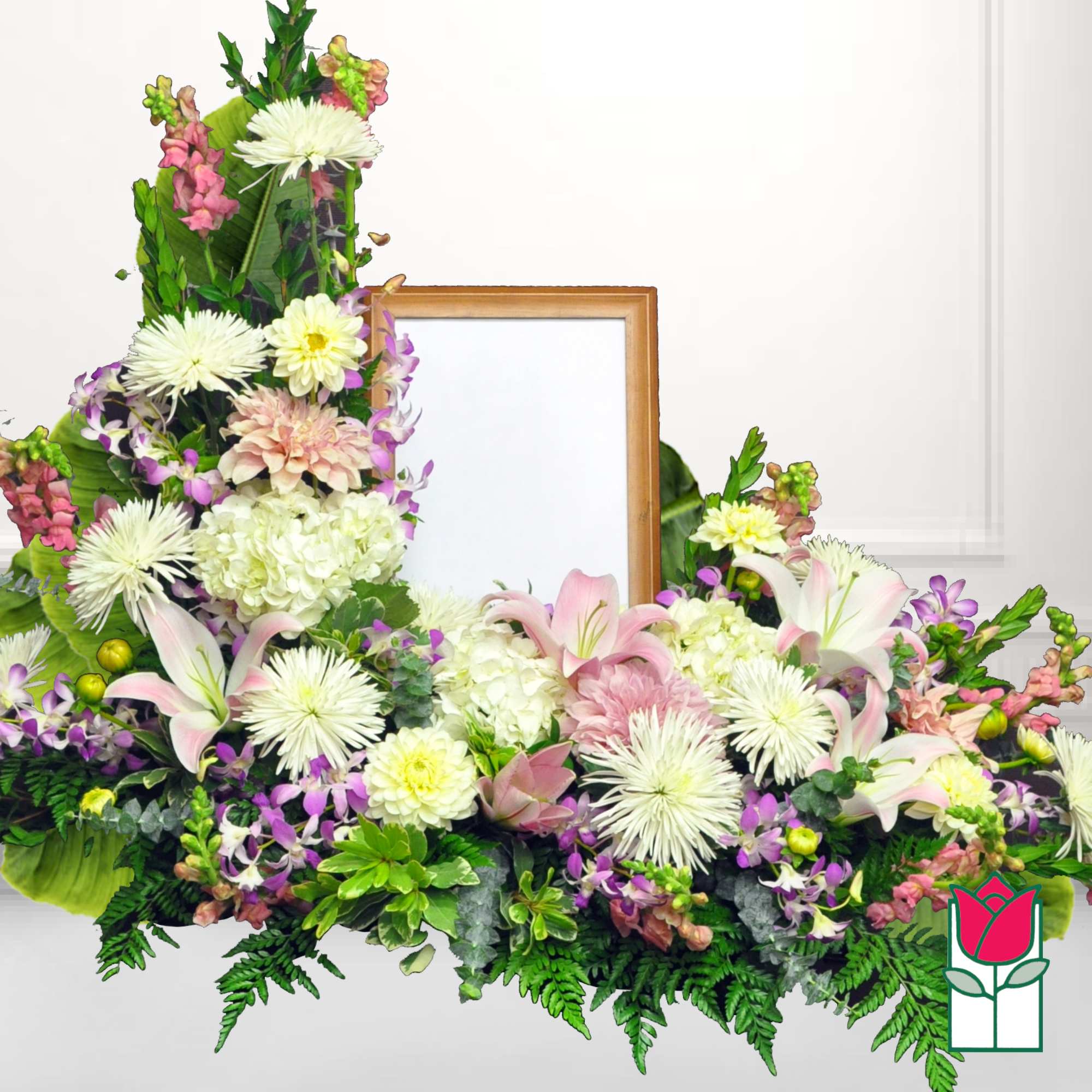 Large floral frame arrangement with lilies, chrysanthemums, and orchids around a blank center