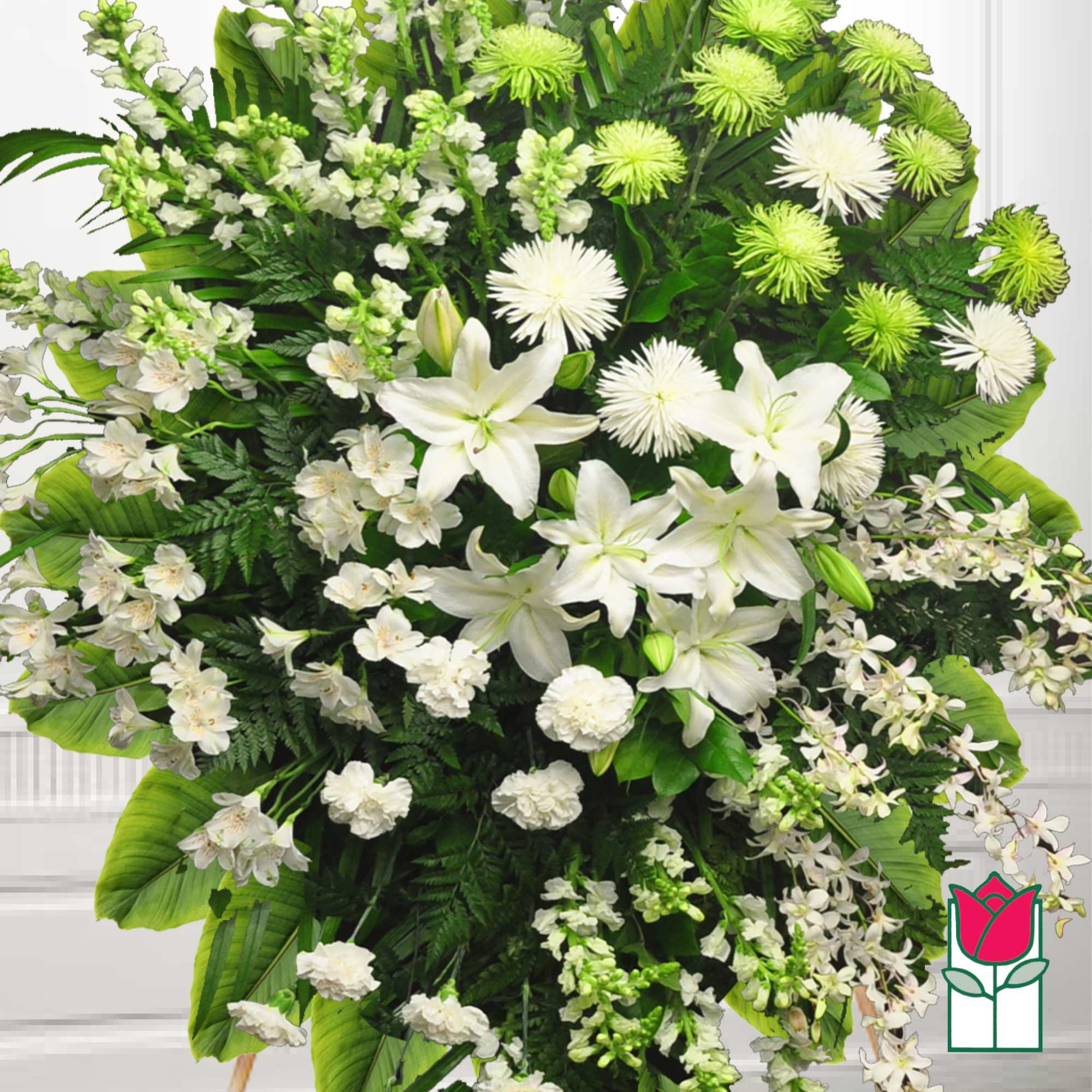 Large white floral spray with lilies and green spider mums