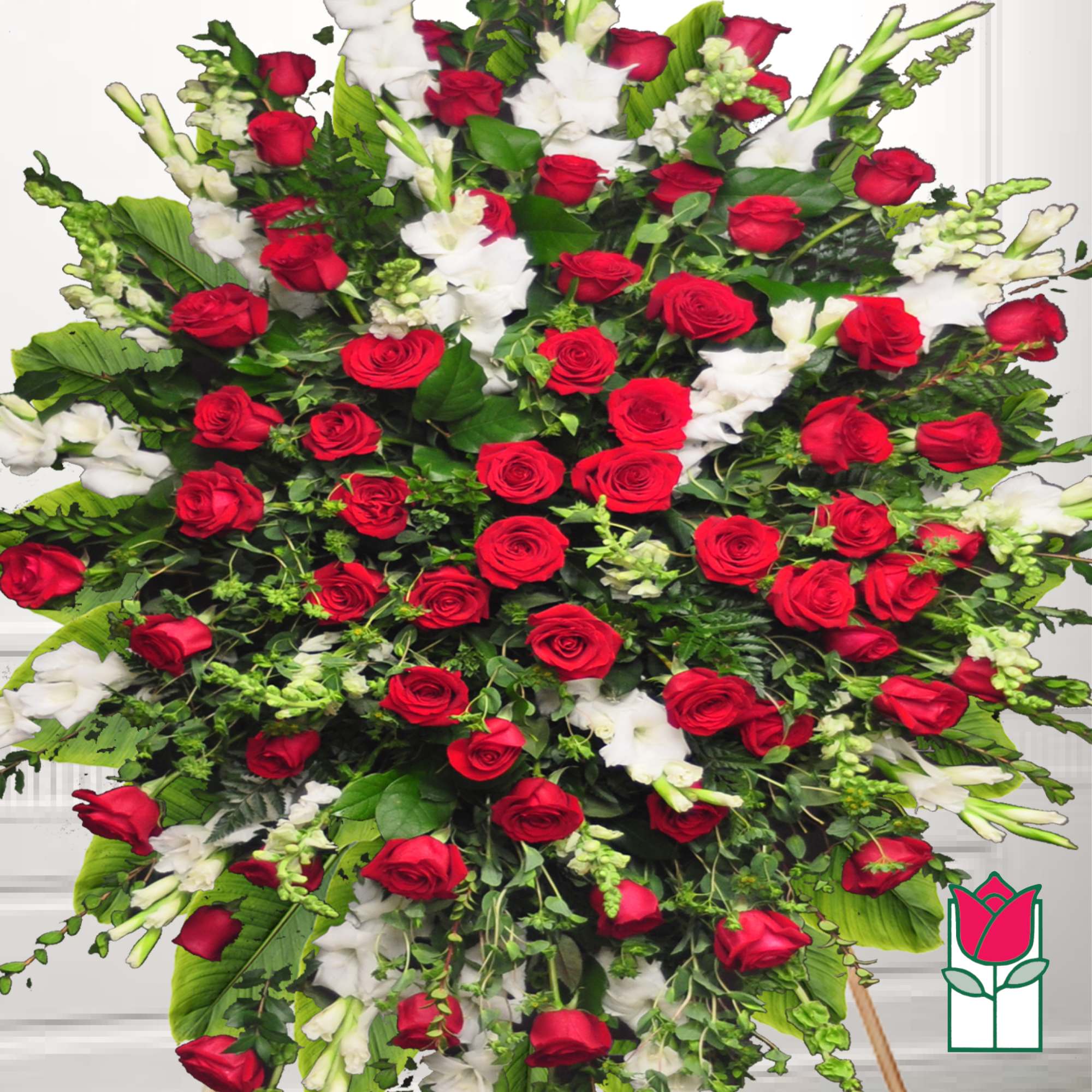 Large standing spray of red roses and white flowers
