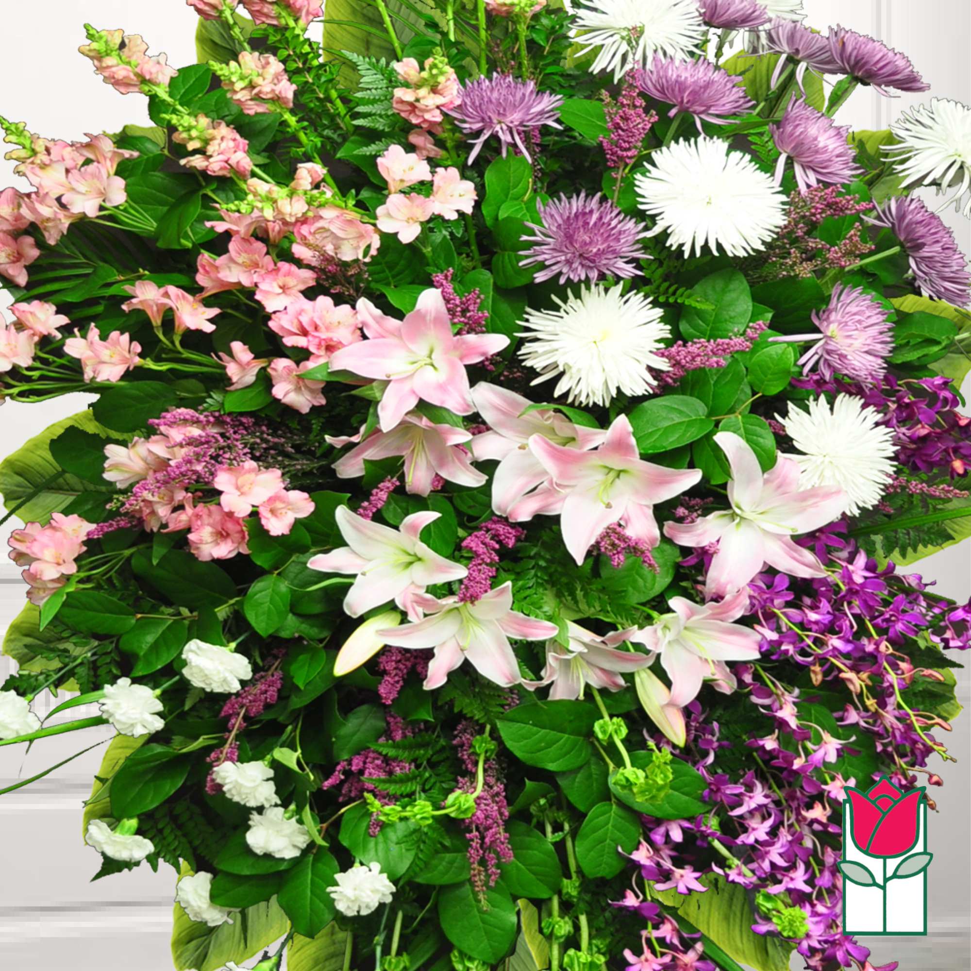 Large bouquet of pink lilies, white spider mums, and purple flowers