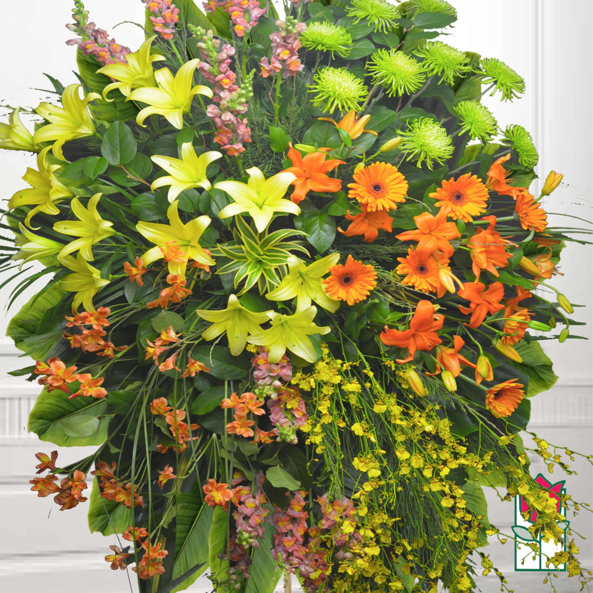 Large standing floral spray with orange and yellow blooms