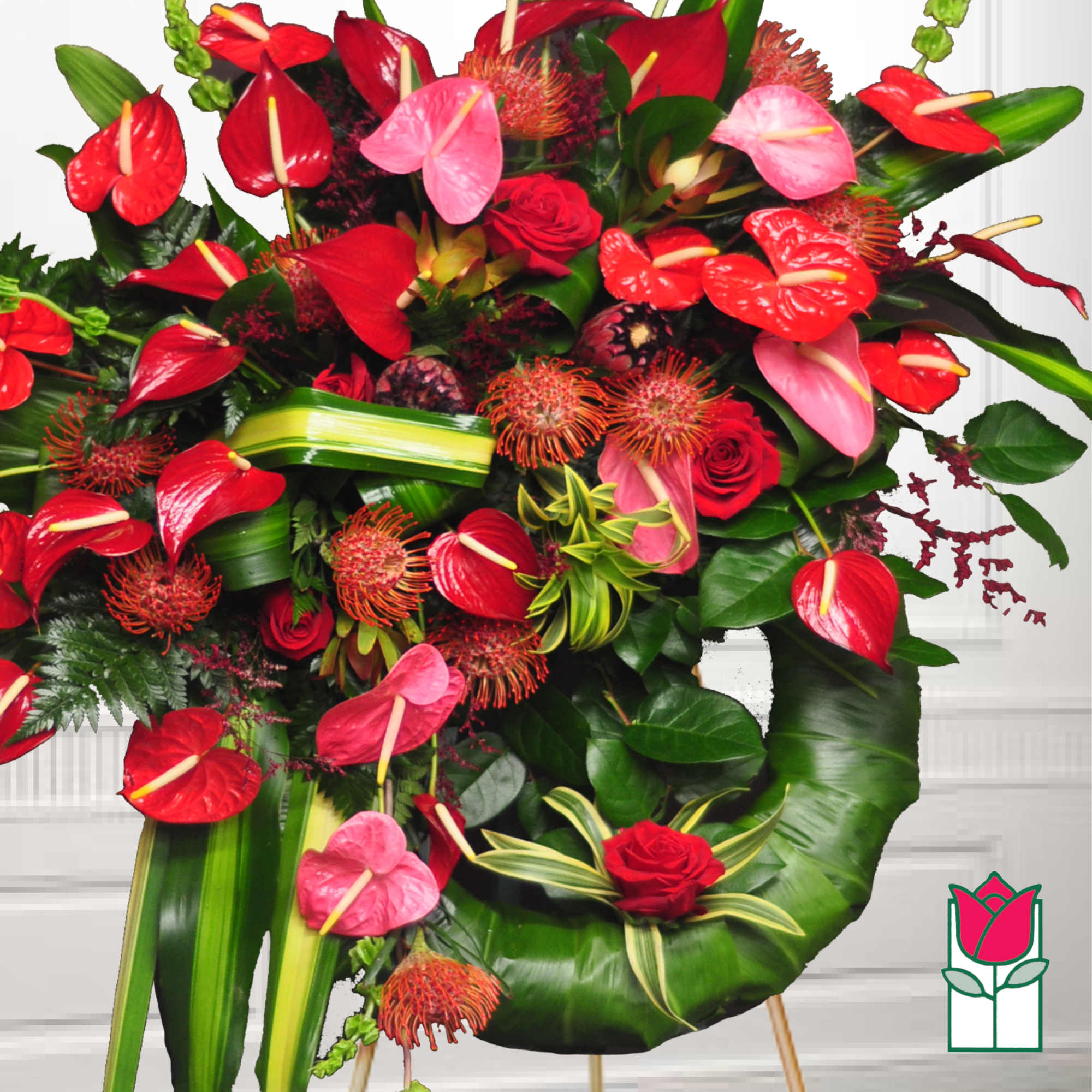 Large bouquet of red and pink tropical flowers with roses