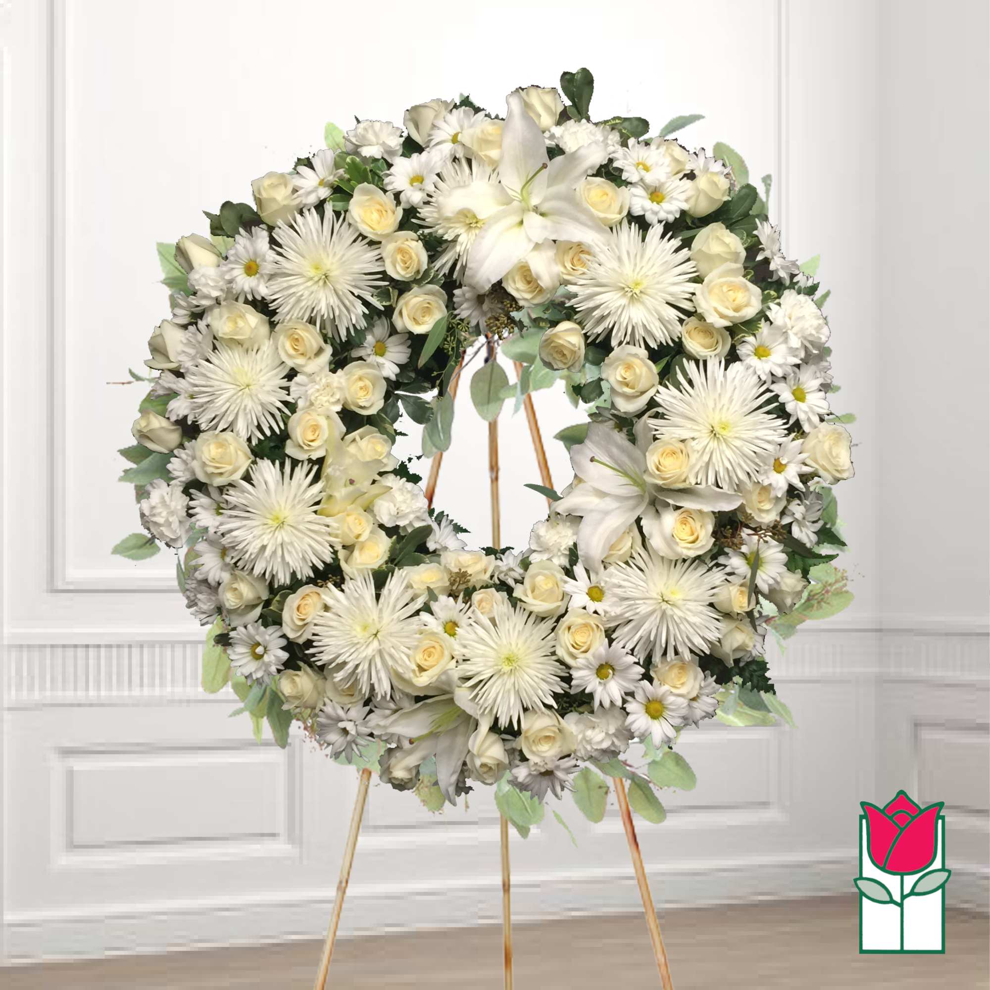 White floral wreath on a standing easel