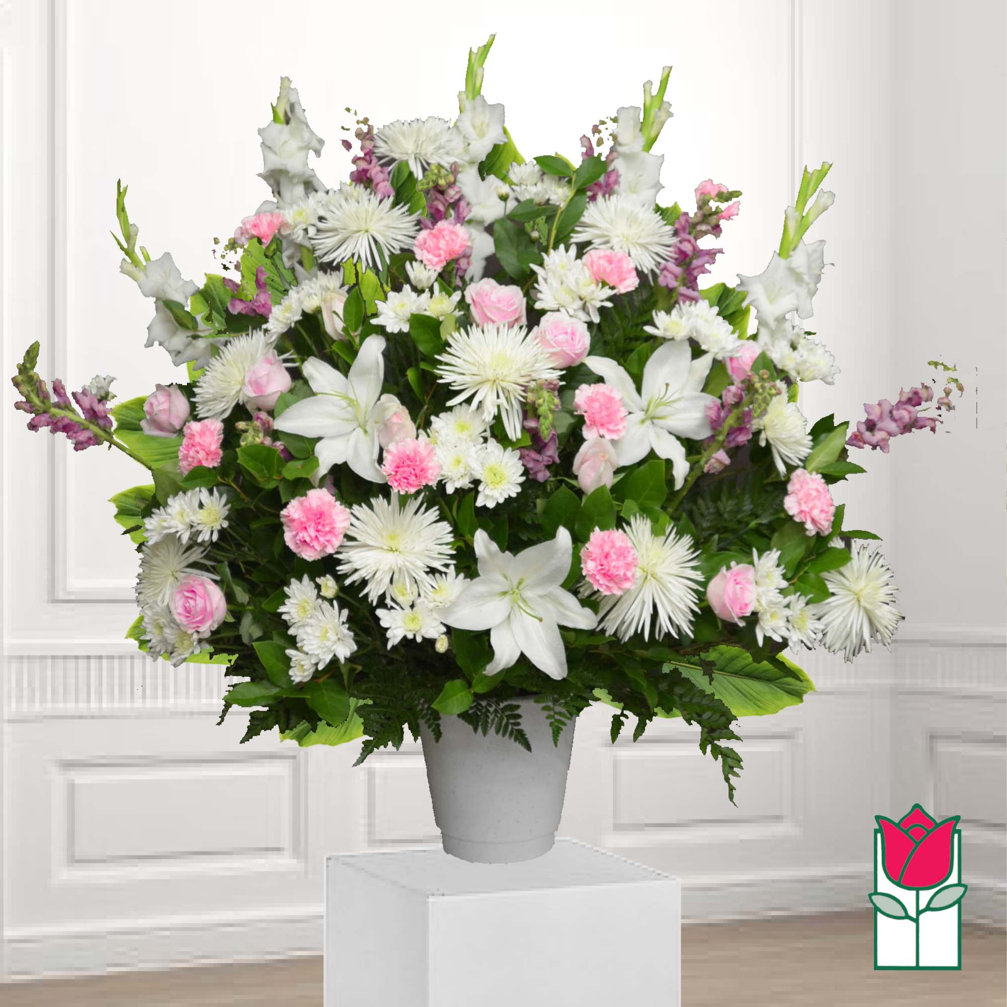 Large white and pink floral arrangement in a gray vase