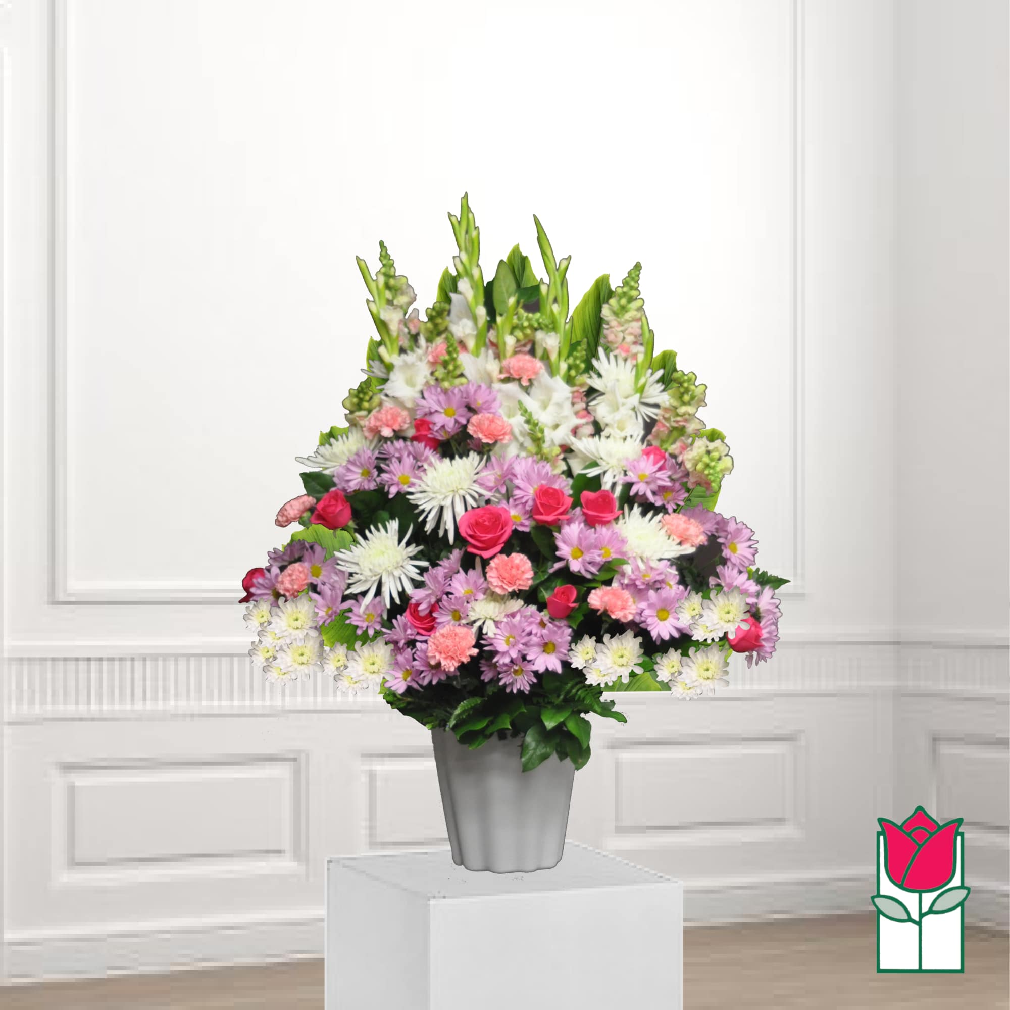 Mixed pink and white flower arrangement in a gray vase