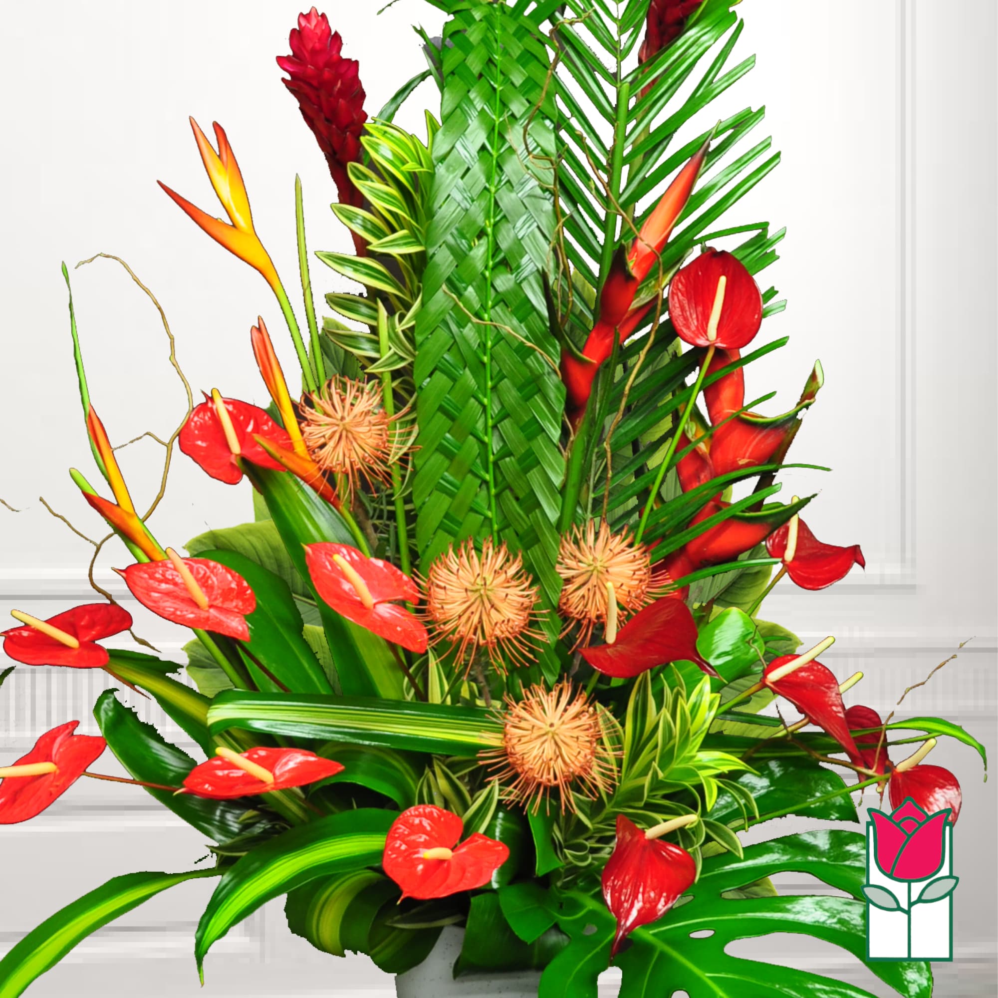 Tropical arrangement with red anthuriums and orange bird-of-paradise flowers