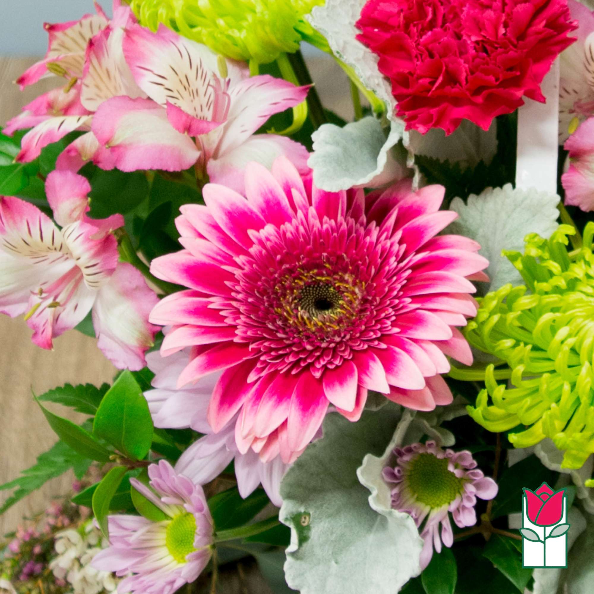 Pink gerbera daisies and alstroemeria with bright green mums