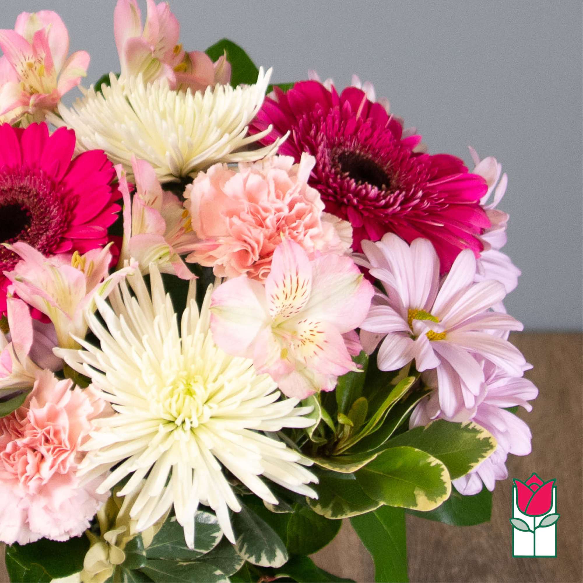 Bouquet of pink, white, and lavender flowers with carnations and daisies