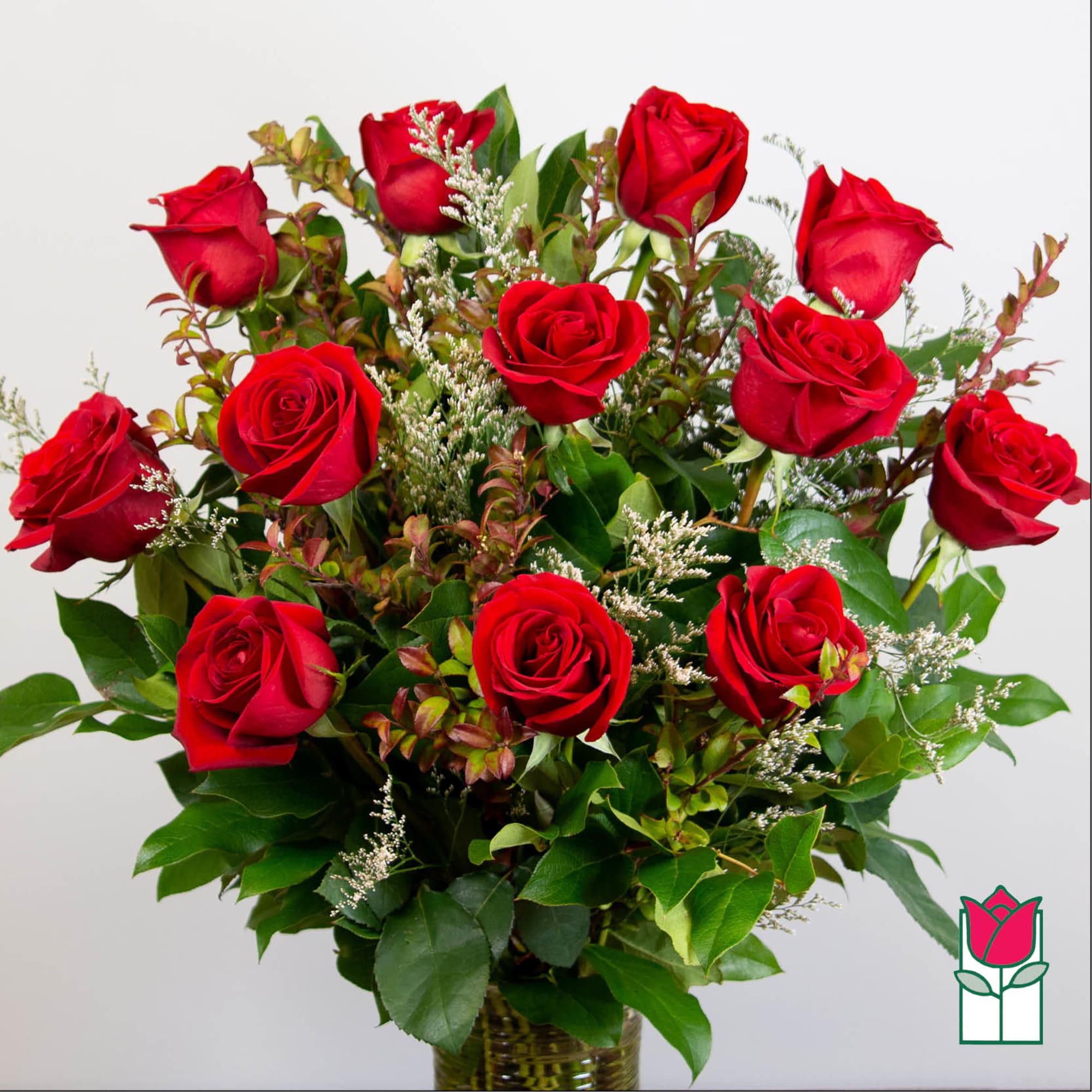 Bouquet of red roses in a glass vase