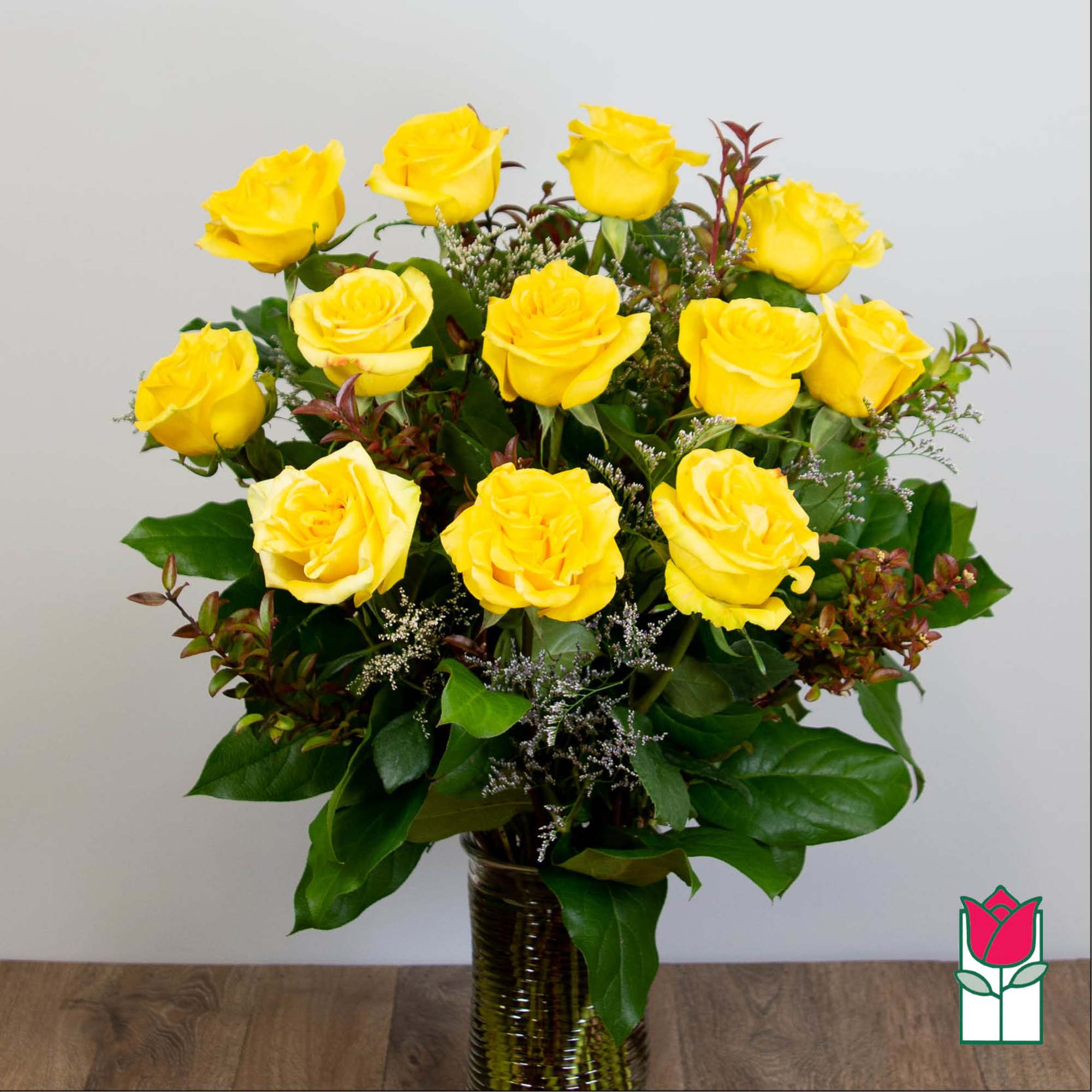 Yellow roses arranged in a glass vase