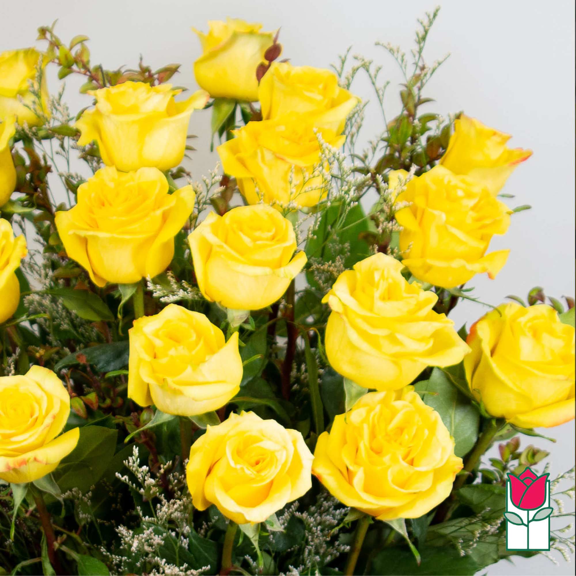 Bouquet of yellow roses with mixed greenery