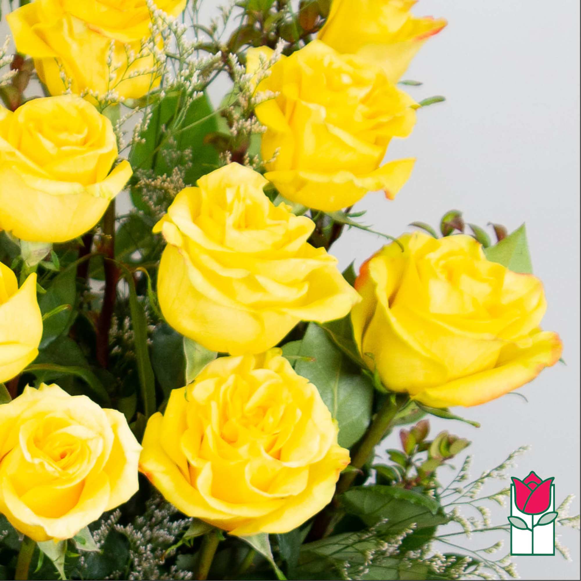Bouquet of yellow roses with greenery