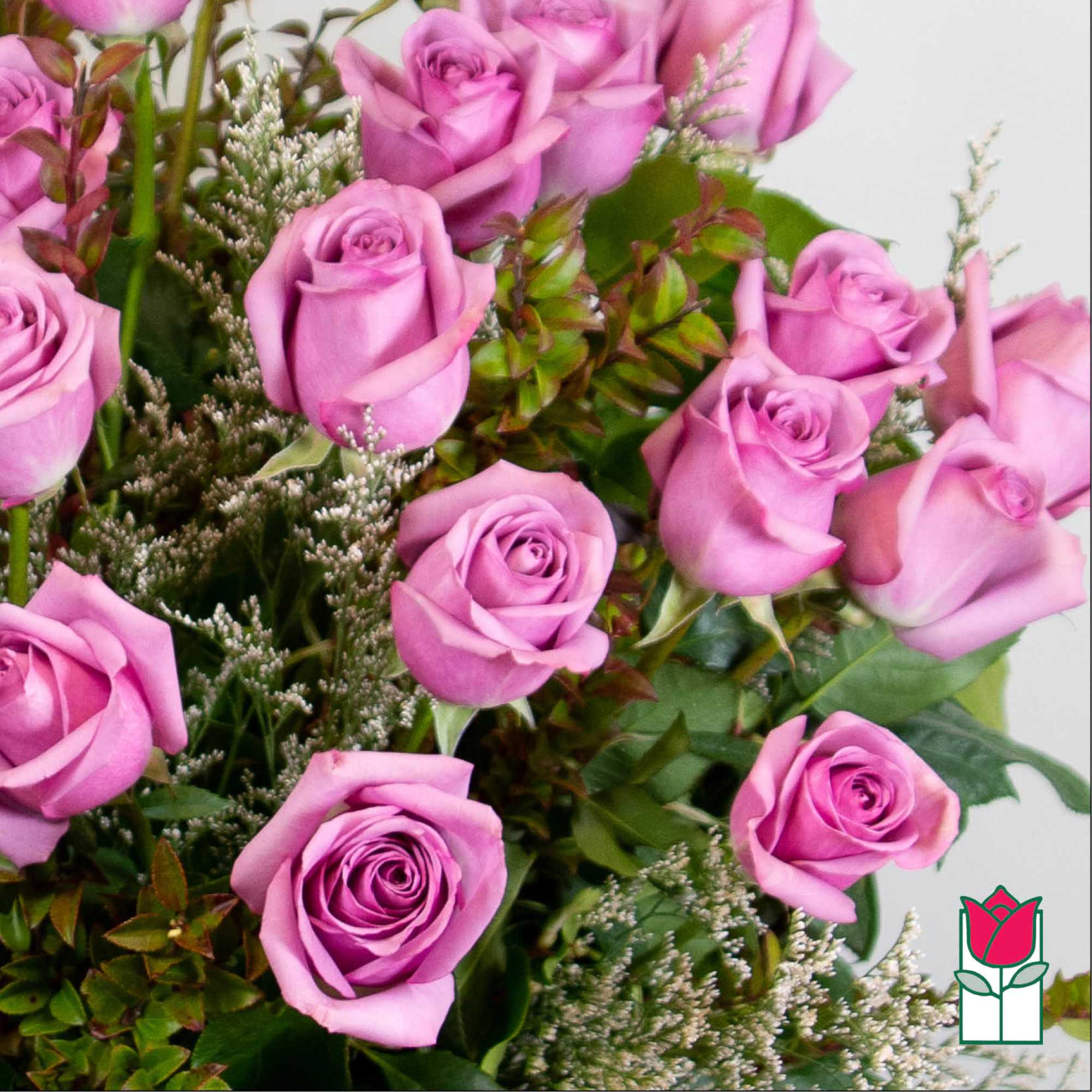Bouquet of lavender roses with mixed greenery