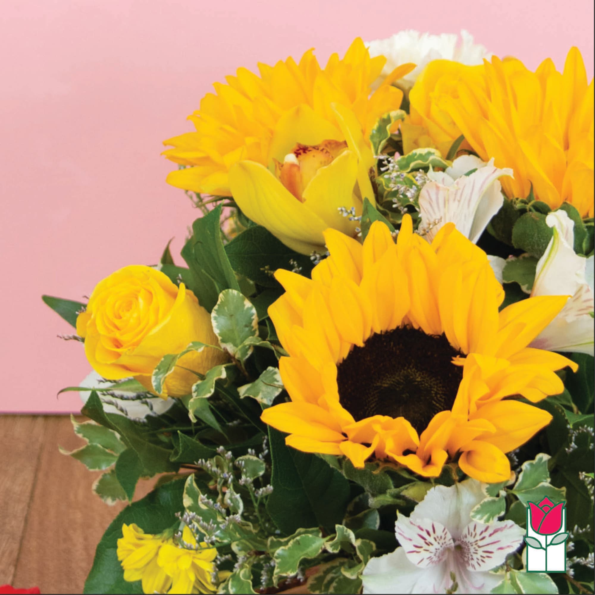 Yellow sunflowers and roses with white alstroemeria in a bouquet
