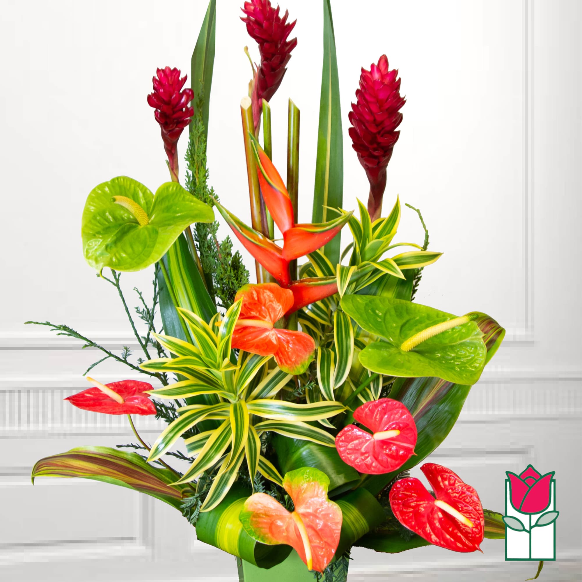 Tropical arrangement with red and green anthuriums and red ginger flowers