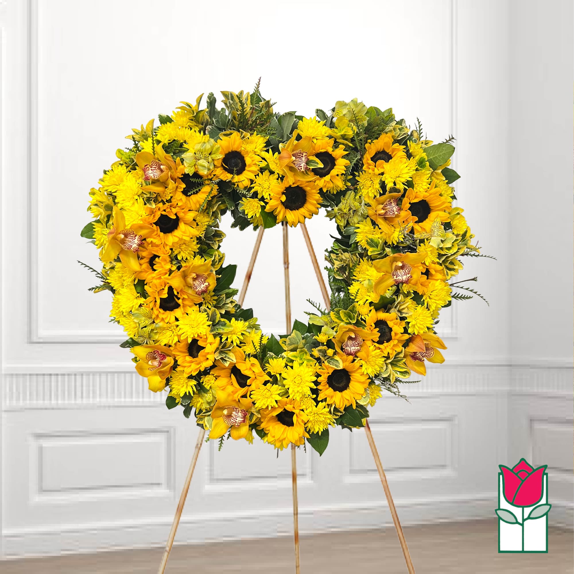Heart-shaped yellow floral wreath on a standing easel