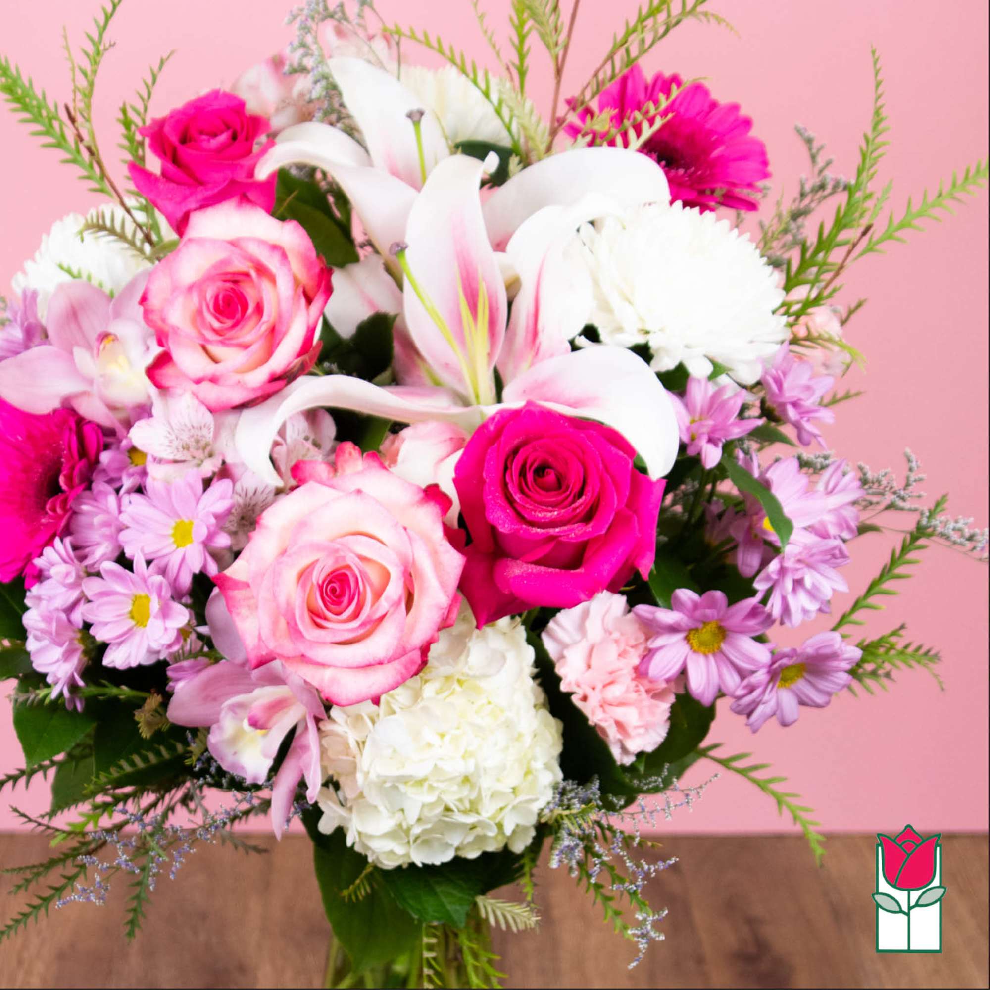 Pink and white mixed bouquet with roses, lilies, and daisies