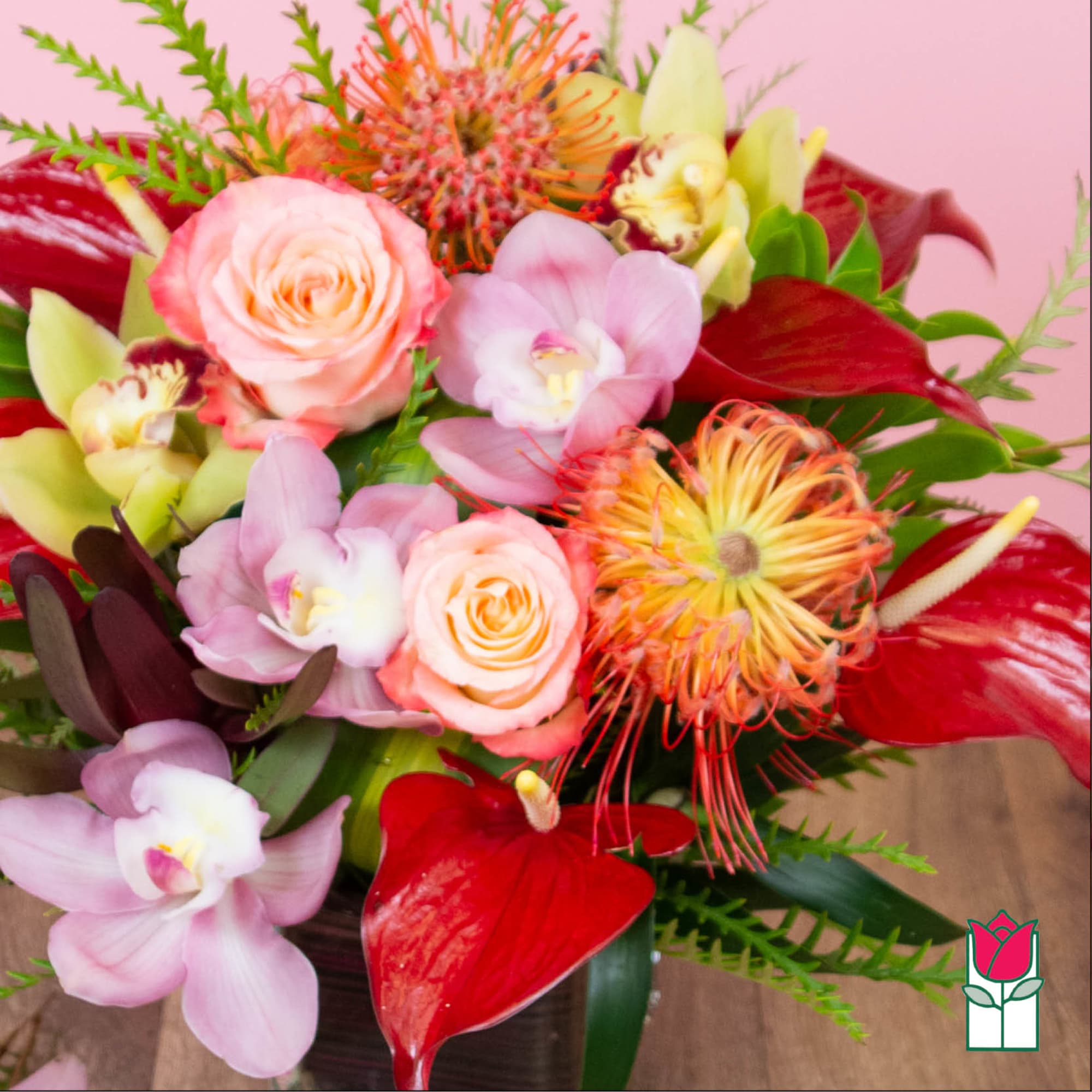 Bouquet of pink roses, orchids, and red anthuriums