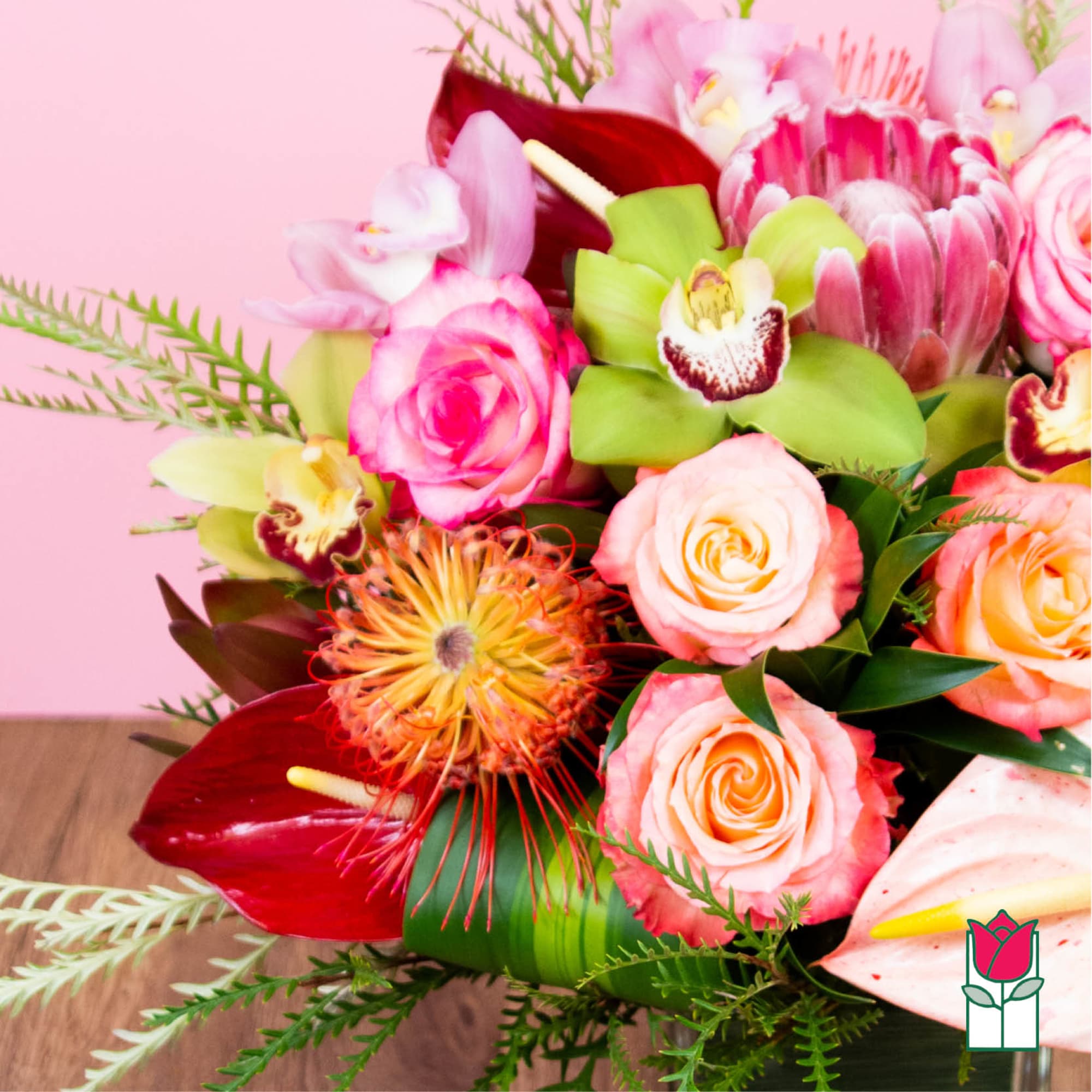 Bouquet of pink roses, orchids, and red anthuriums